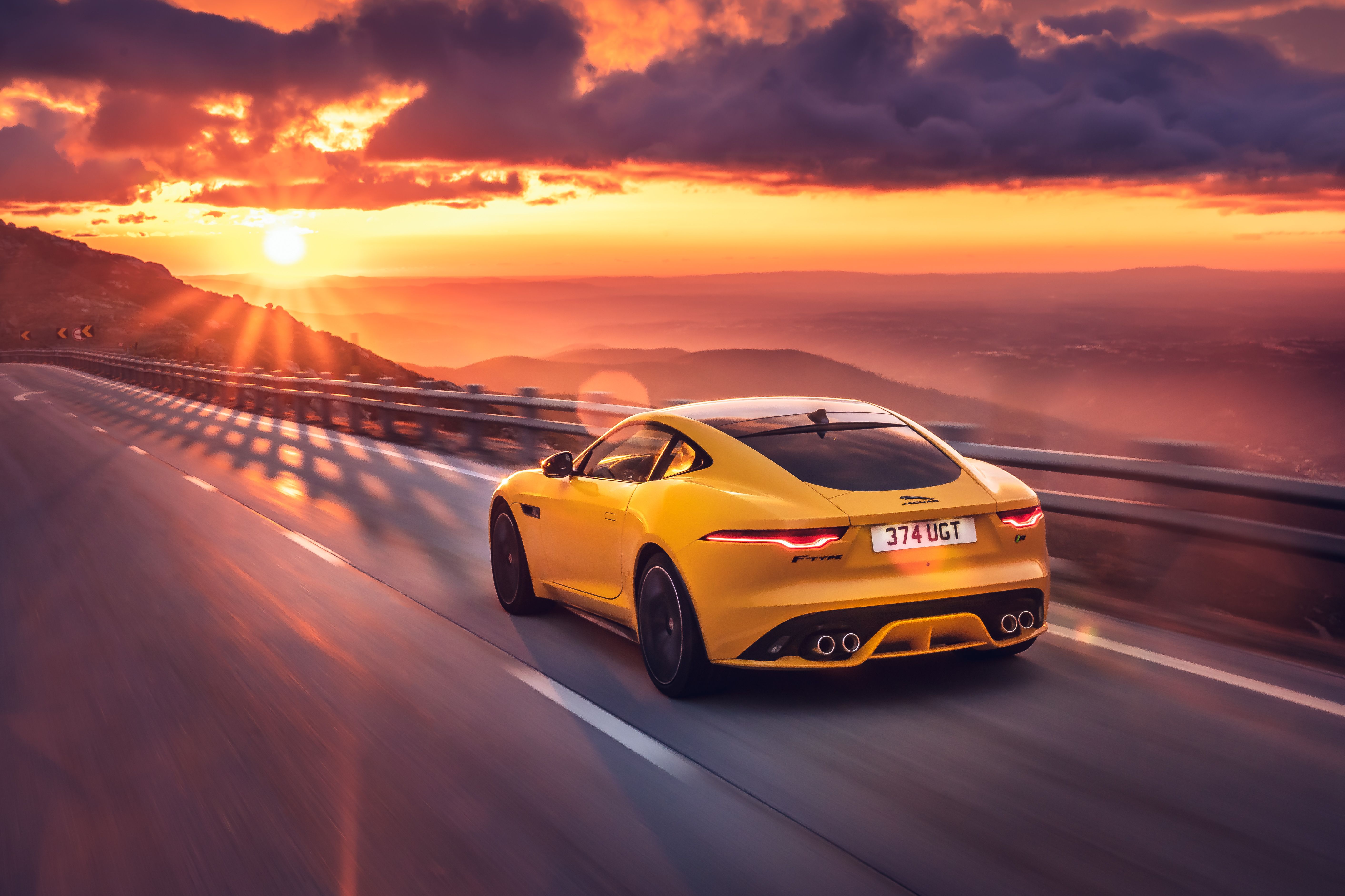 Yellow Jaguar F-Type R Coupe driving