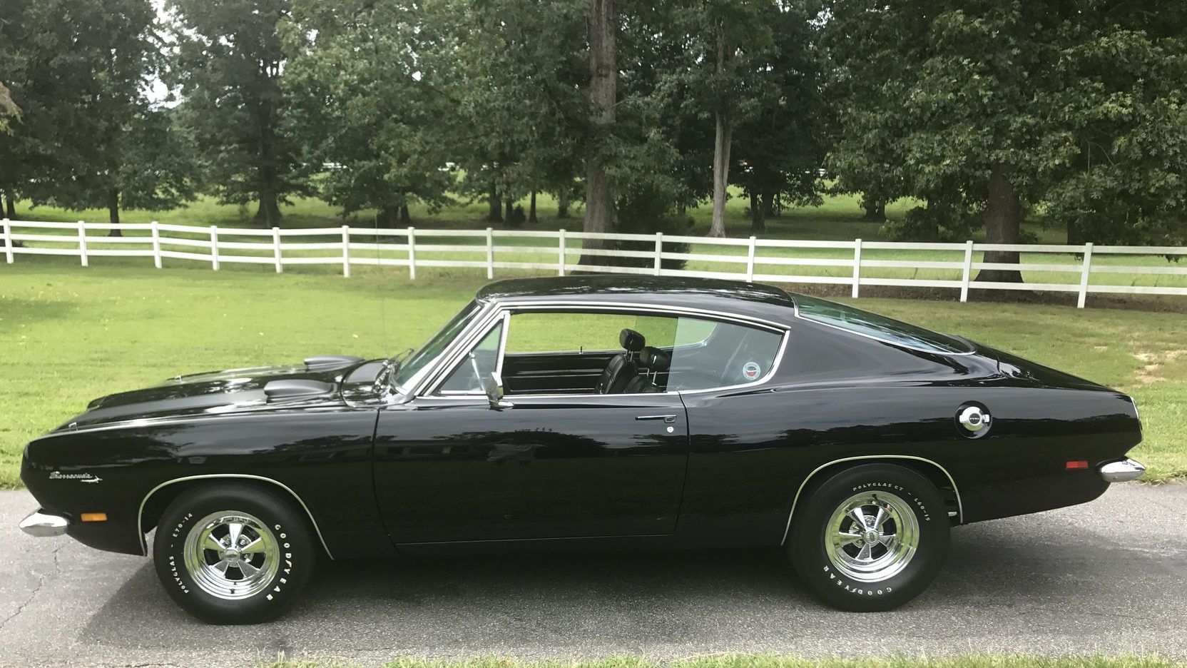A parked black 1969 Plymouth Barracuda