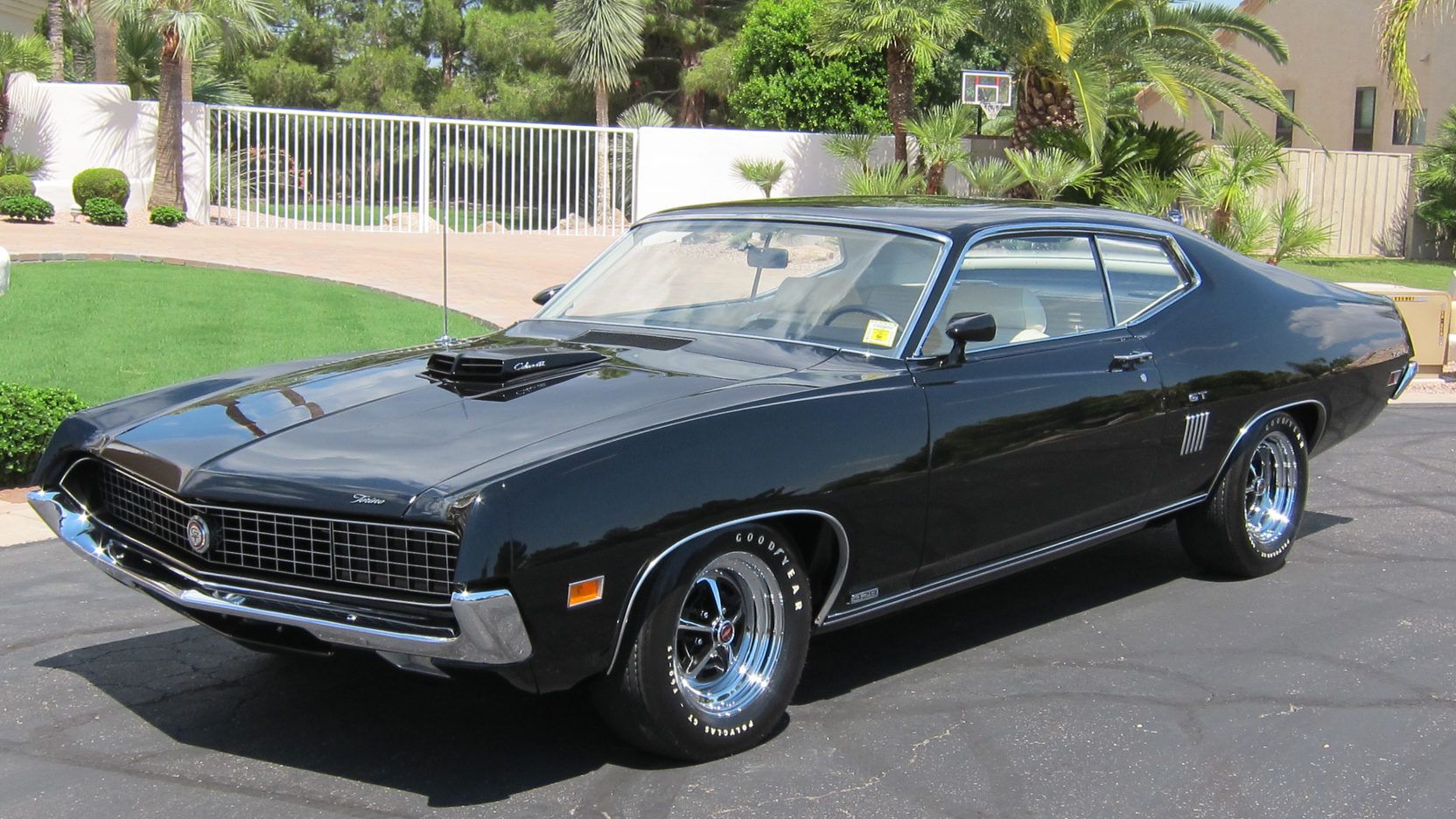 A parked black 1970 Ford Torino GT