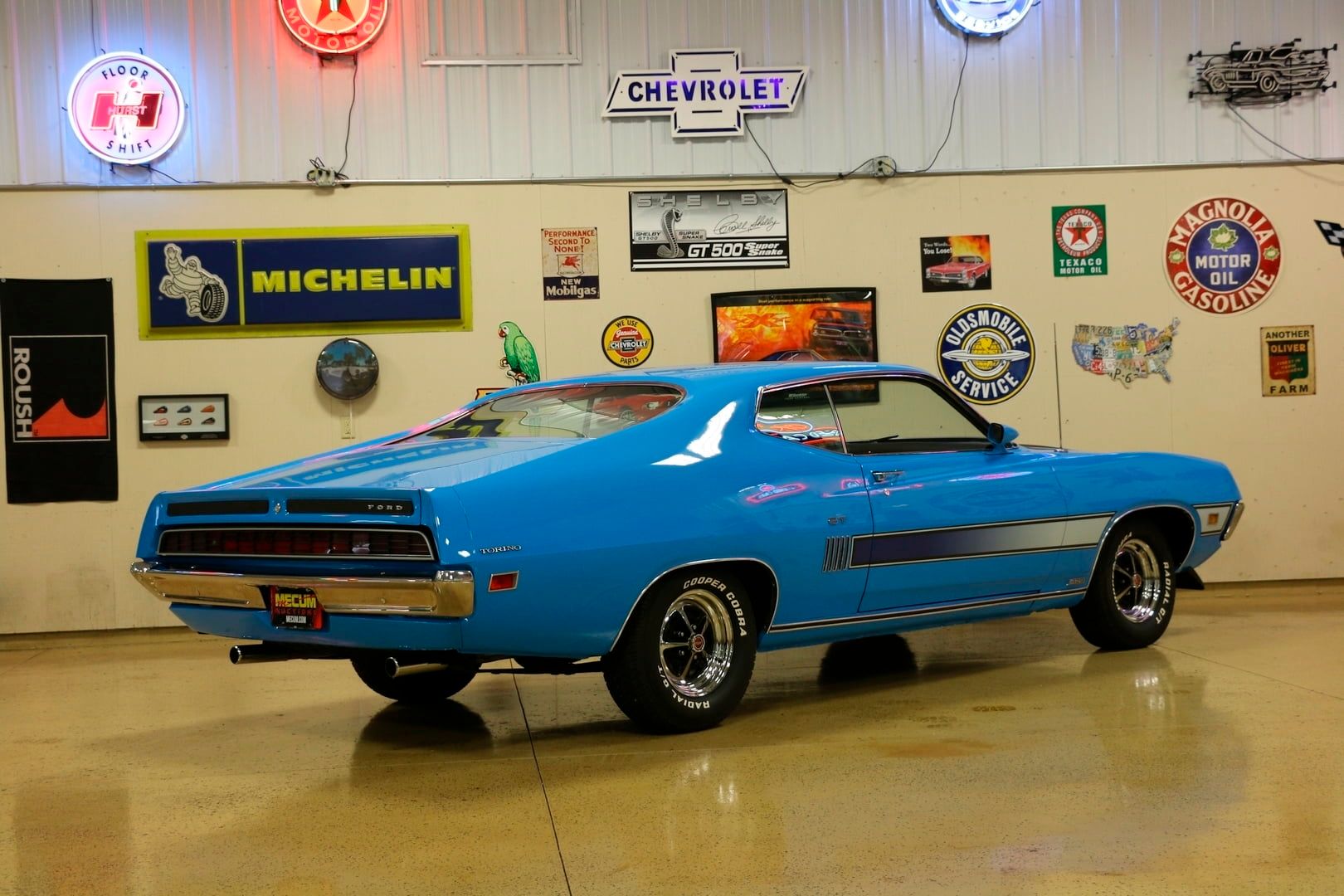 A parked blue 1970 Ford Torino Gt