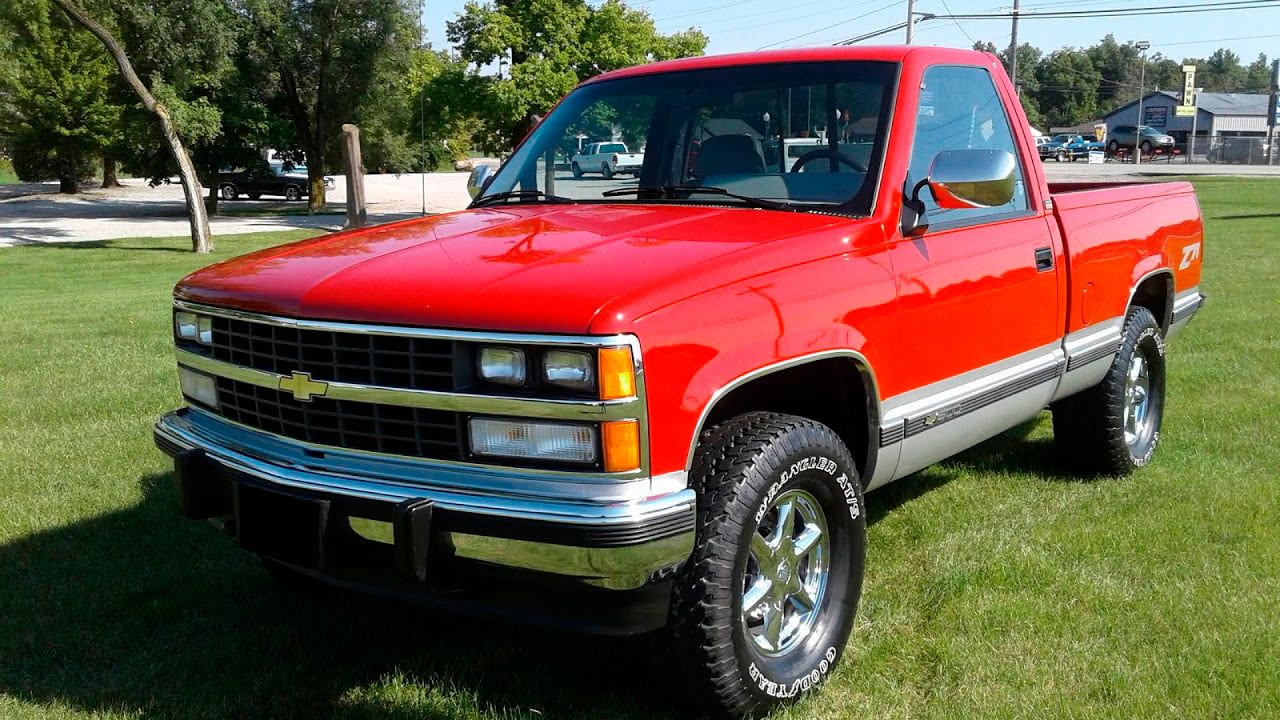 A parked red 1988 GMC Sierra