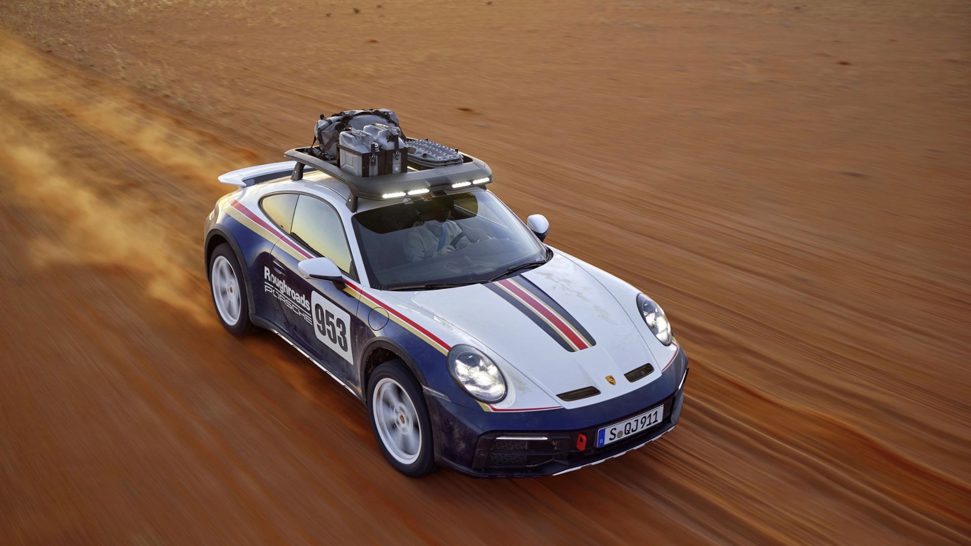 2023 Porsche 911 Dakar crossing a desert