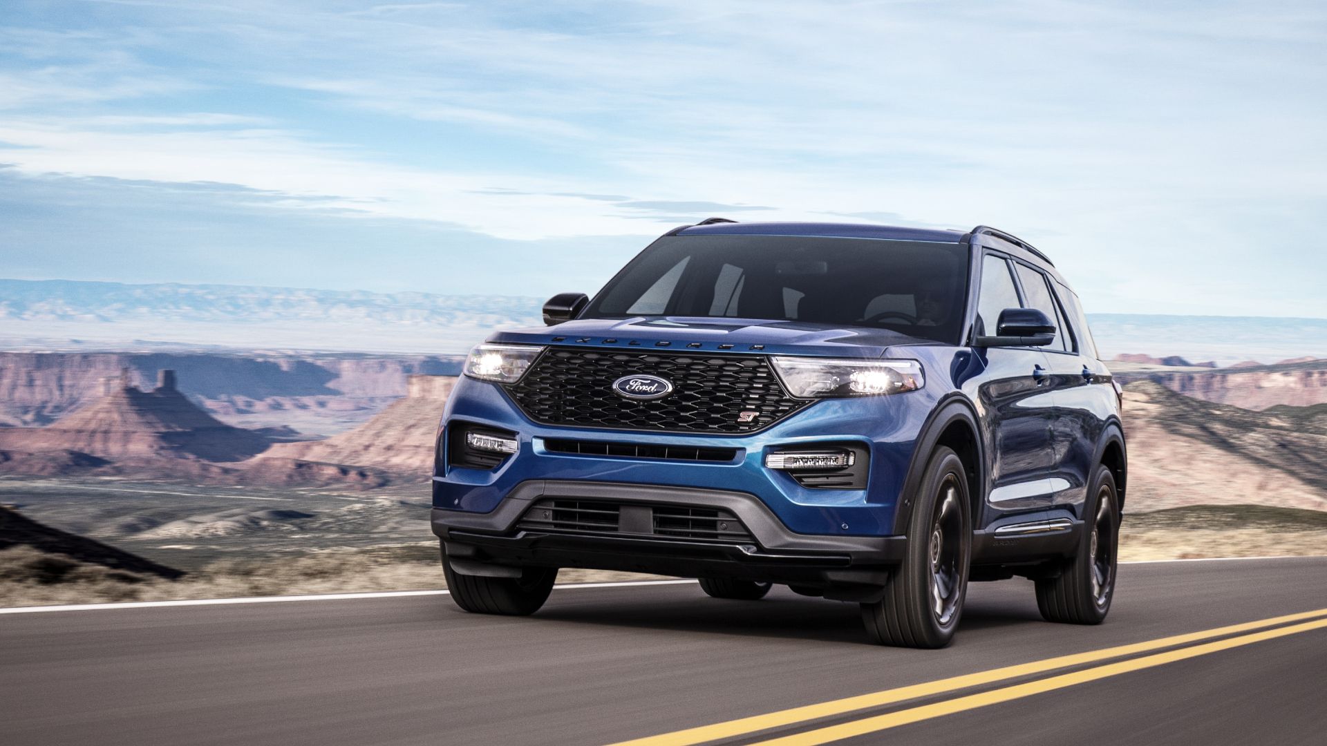 Action shot of a blue 2020 Ford Explorer ST driving