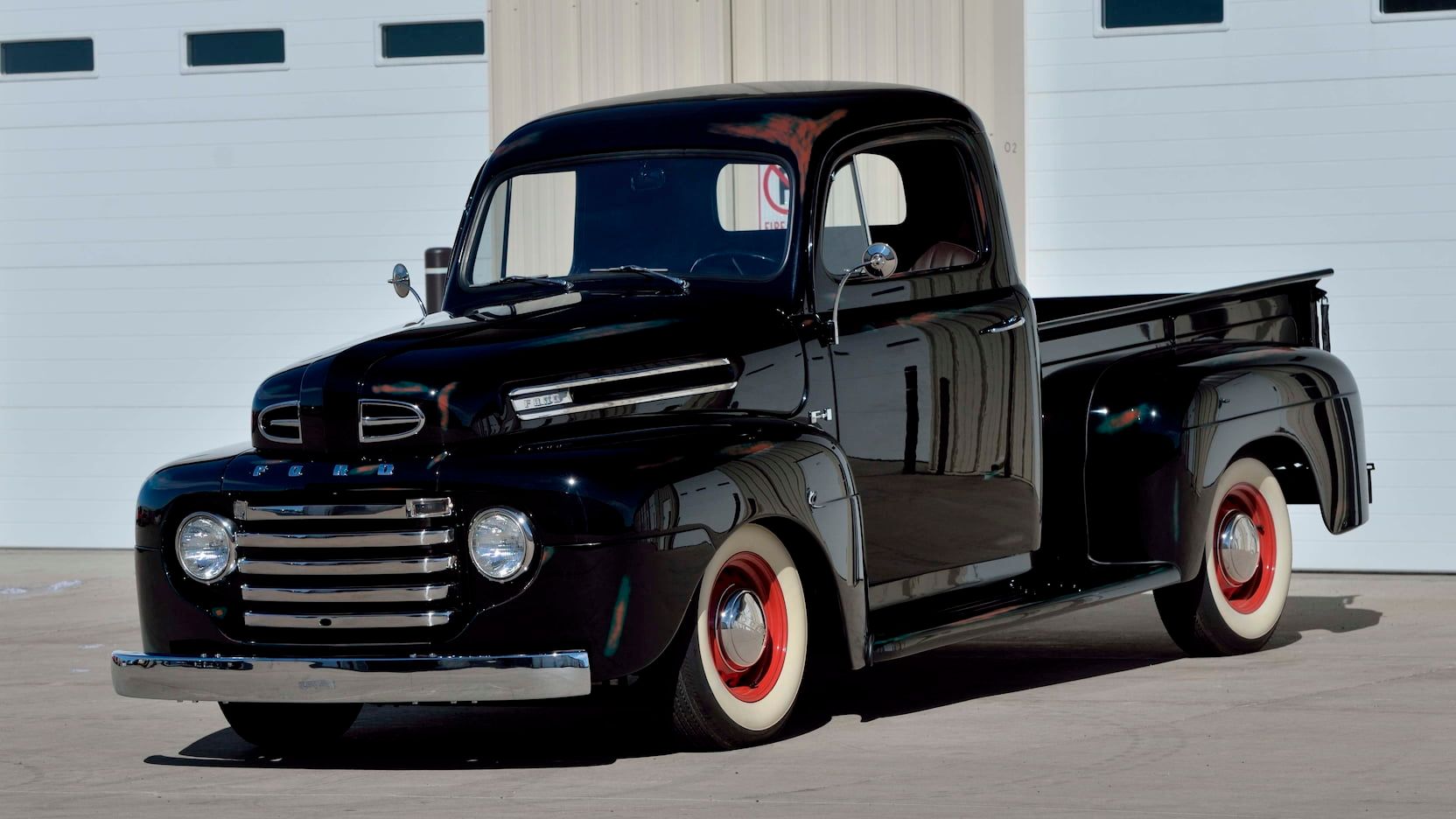 A parked black 1948 Ford f1