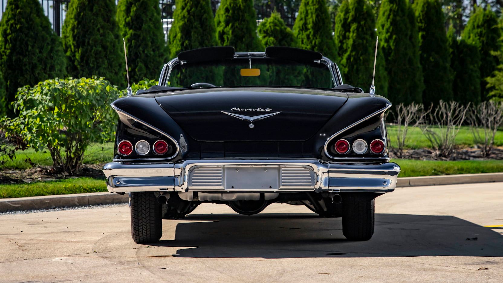 A parked black 1958 Chevy Impala