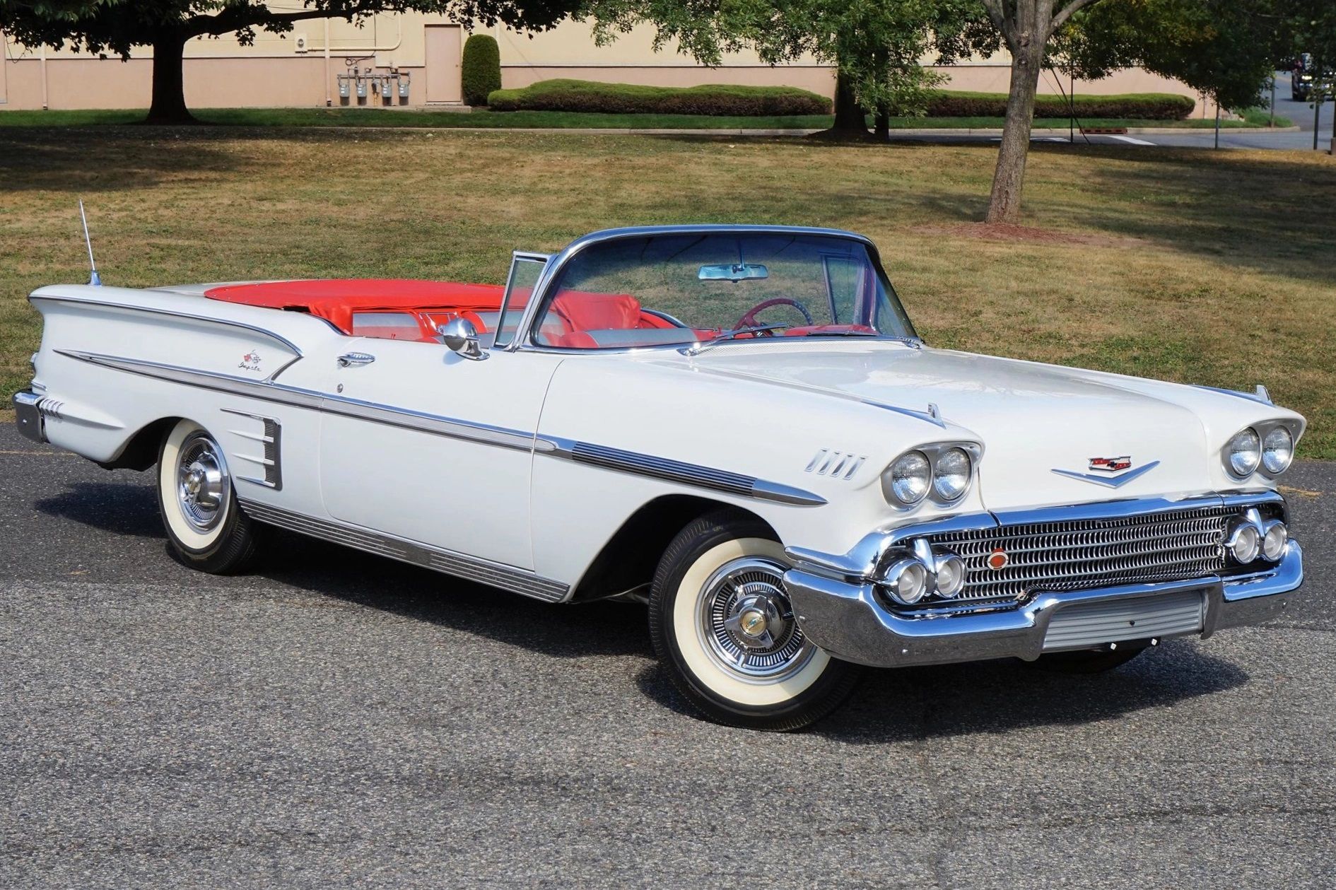 A parked white 1958 Chevy Impala Convertible