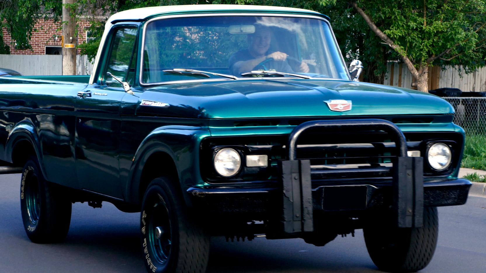 A driving 1962 Ford F100