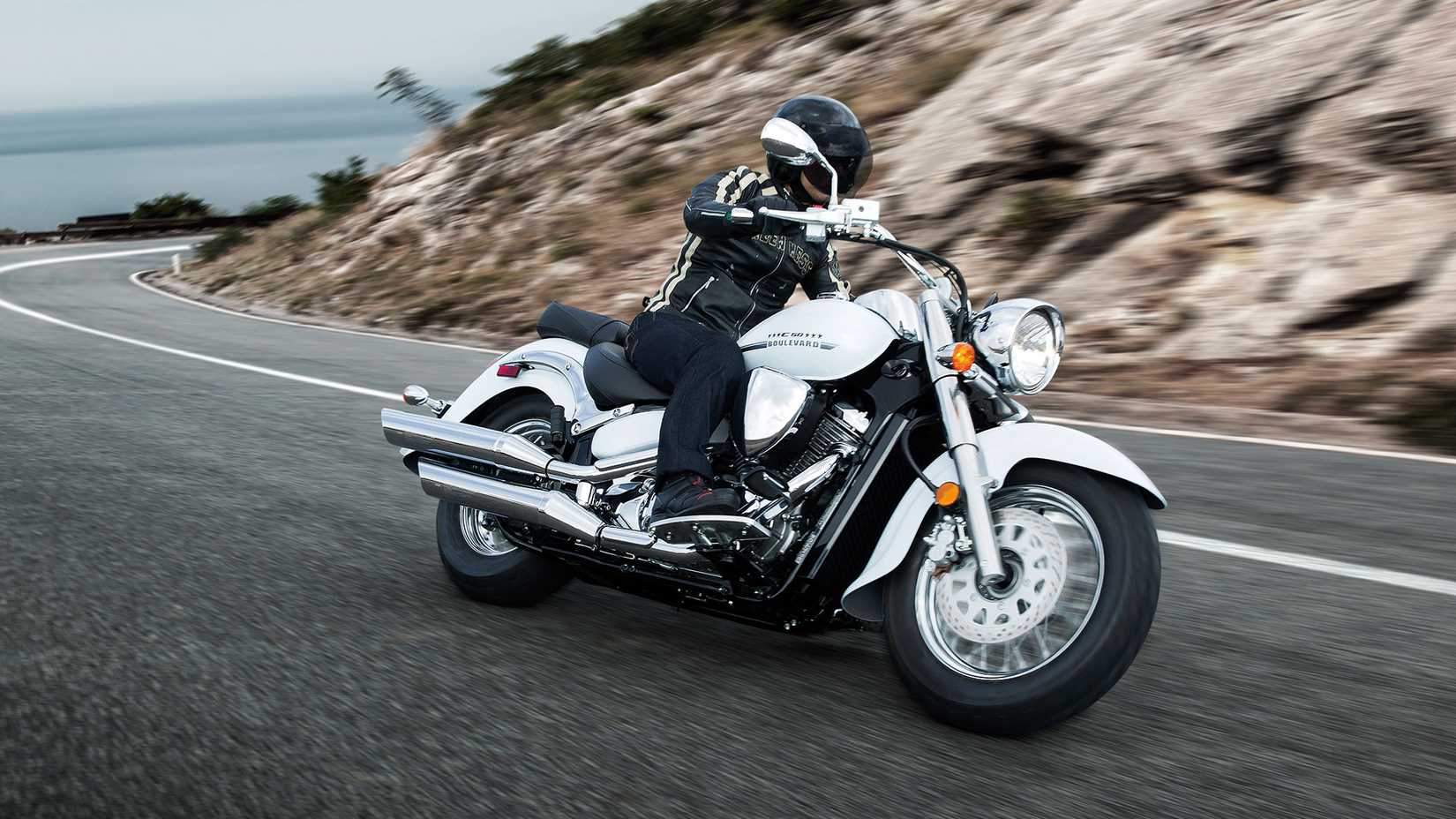 White 2017 Suzuki Boulevard C50 leaning in a curve
