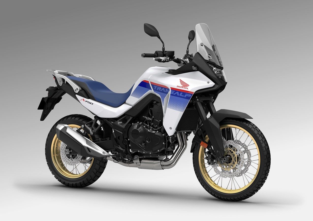 Red, white, and blue 2023 Honda Transalp XL750facing right