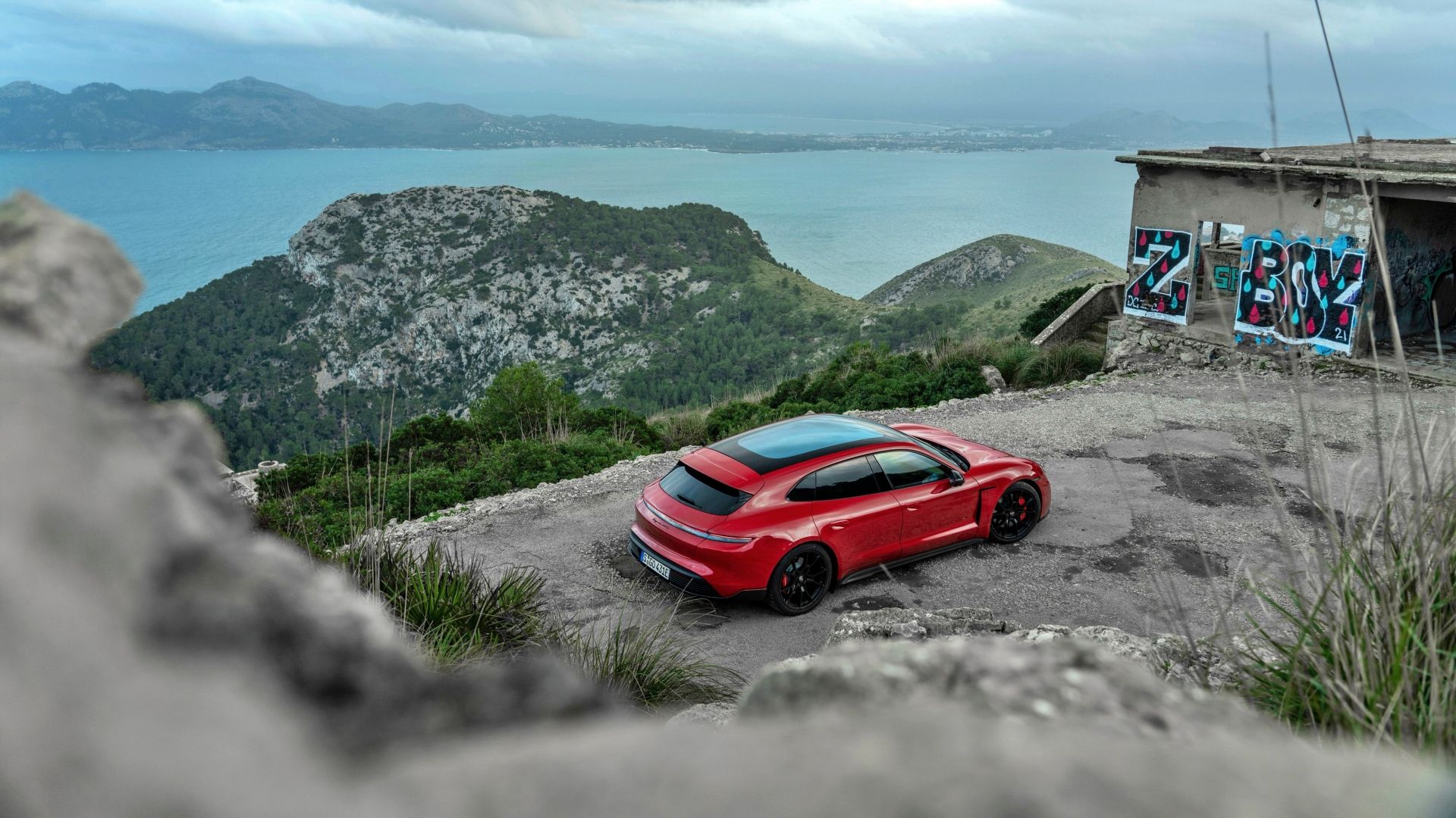 A red Porsche Taycan GTS Sport Turismo