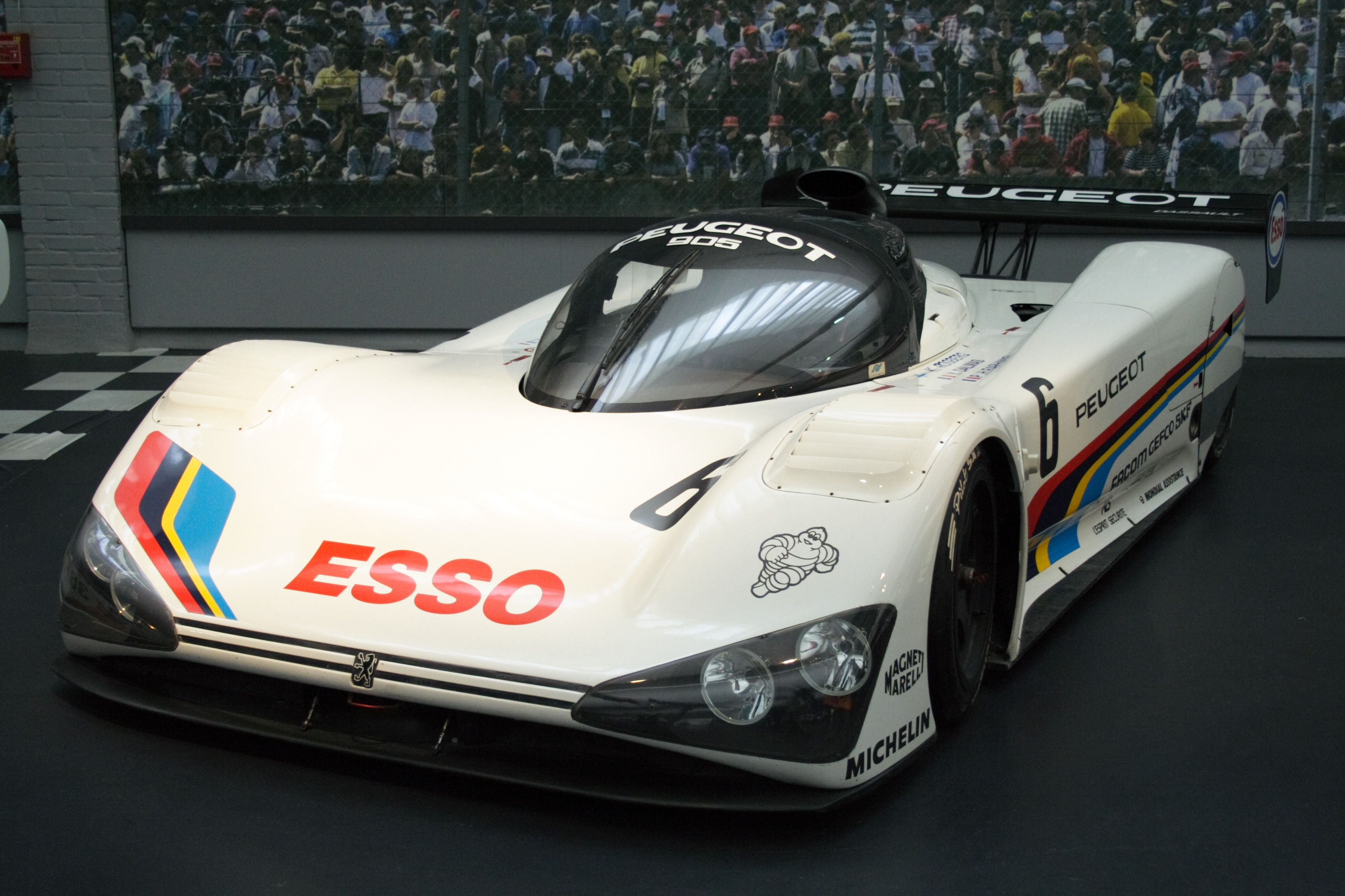 Peugeot 905 parked indoors.