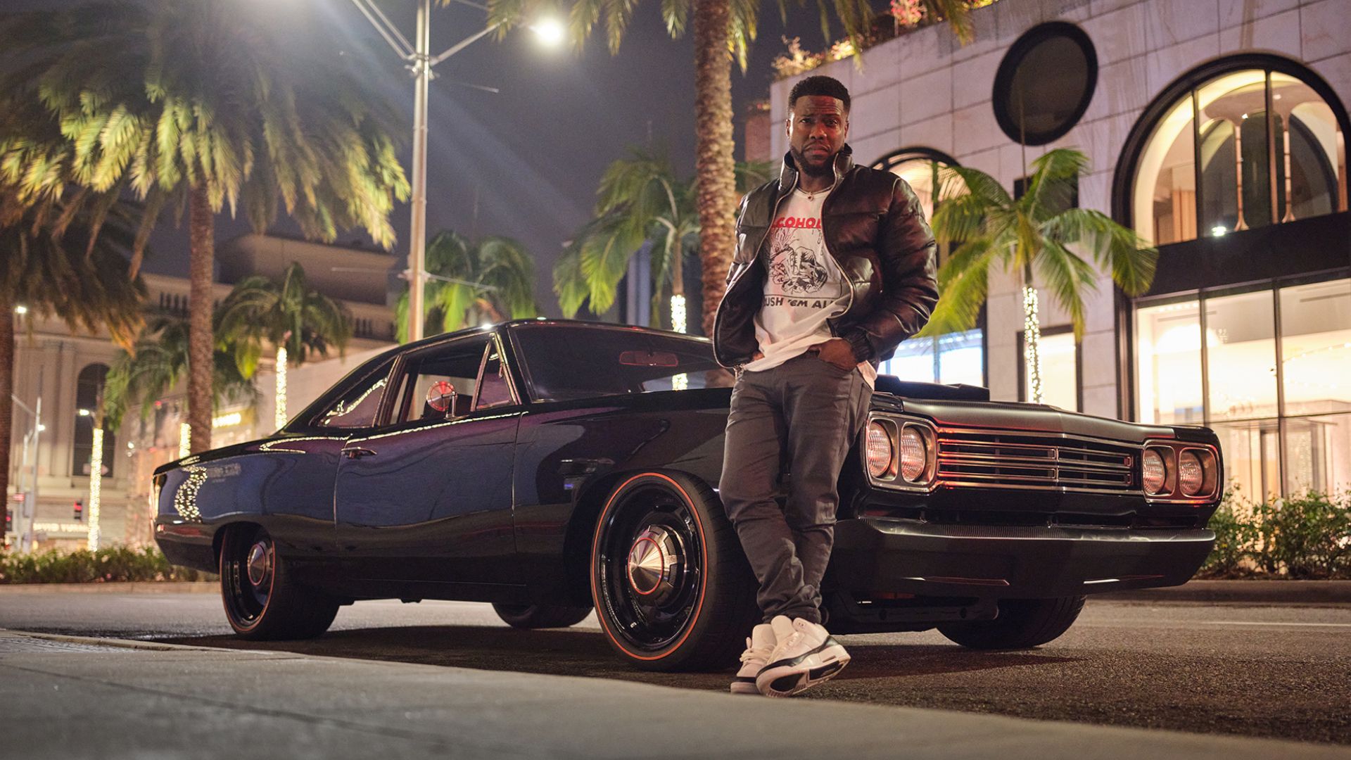 Kevin Hart posing next to his 1969 Plymouth Road Runner ‘Mike Meyers’. 