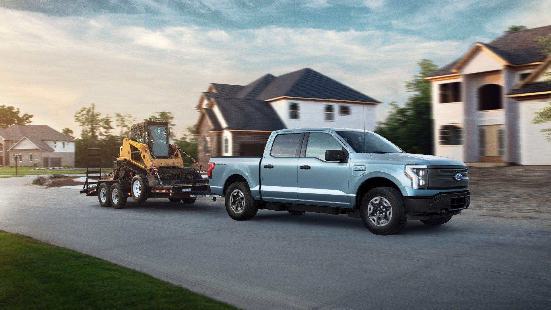 Ford-F-150-Lightning towing a small loader