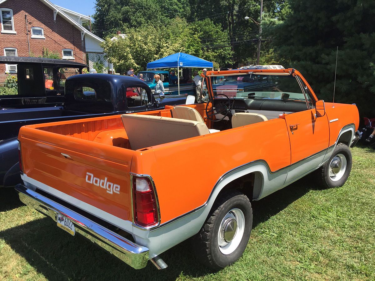 A 1974 Dodge Ramcharger parked and on display with the hood off