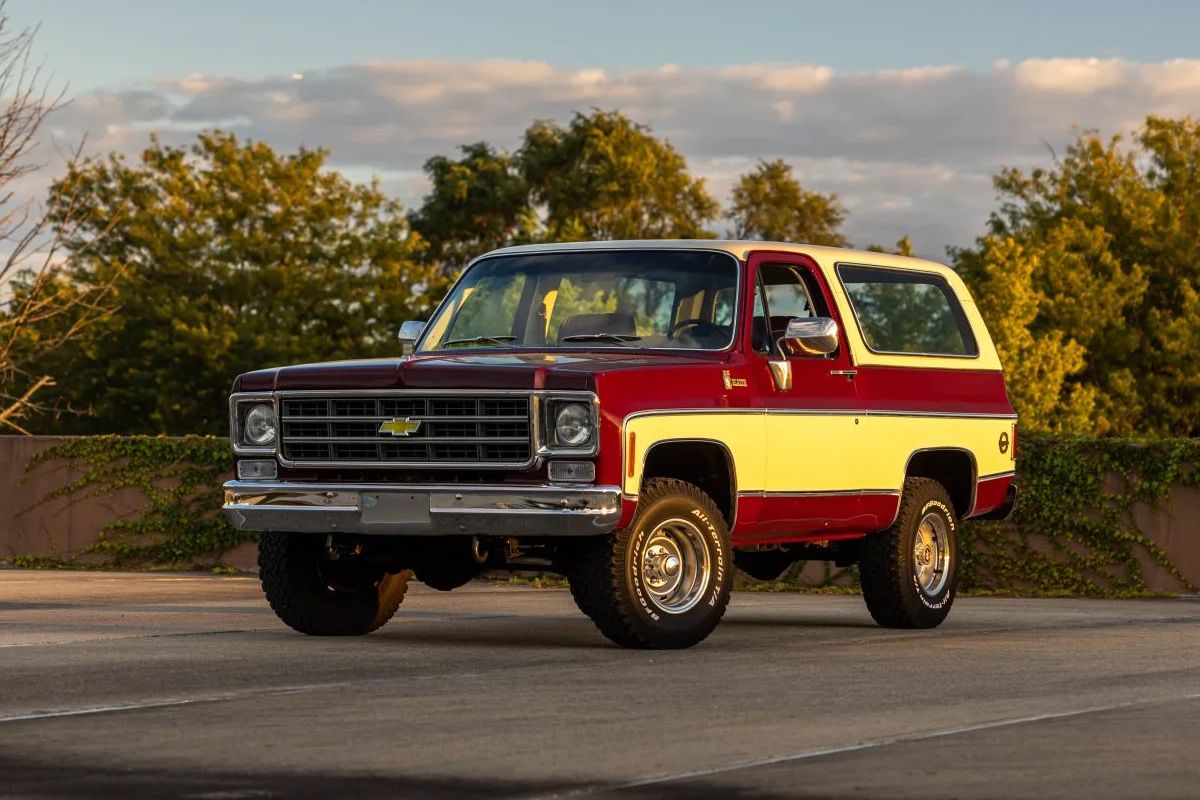 A front three-quarters shot of a red and yellow 1978 Chevrolet K5 Blazer.