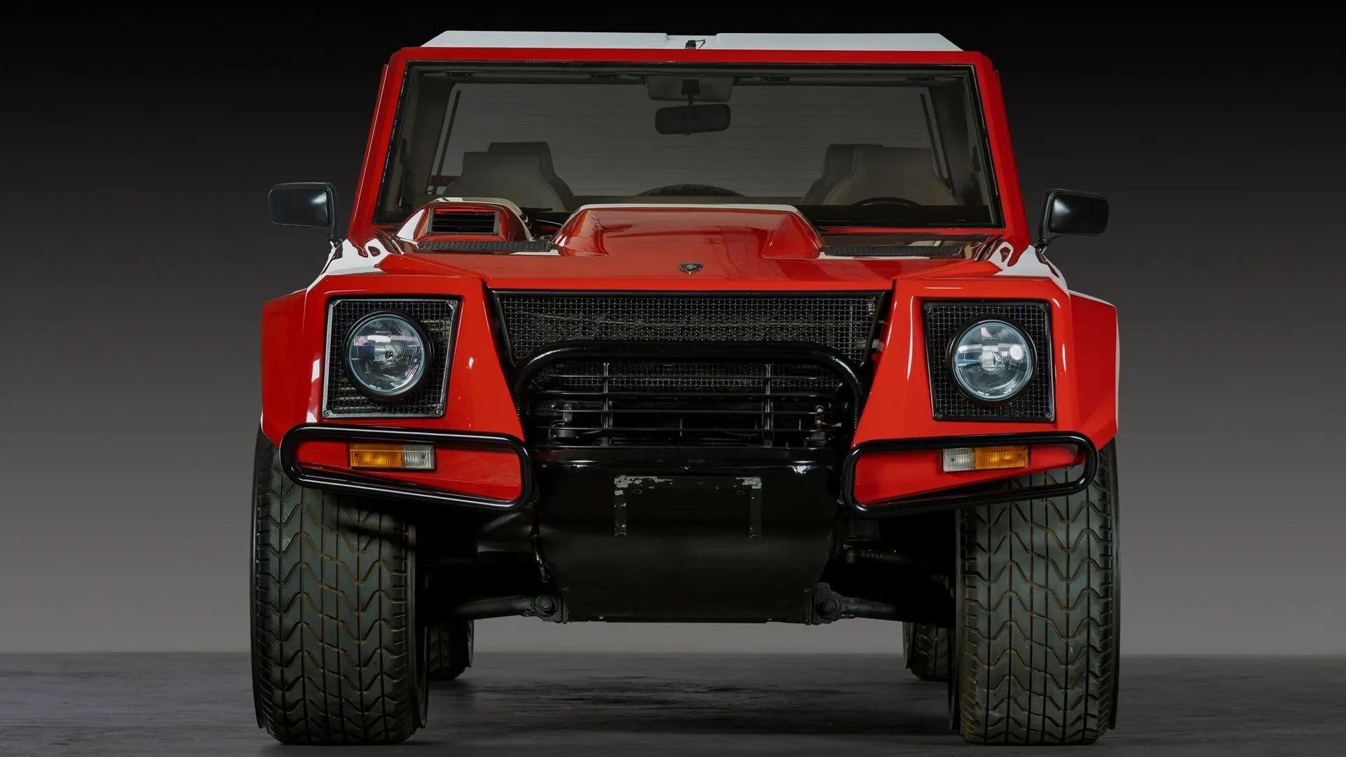 Front view of a red Lamborghini LM002 from 1991