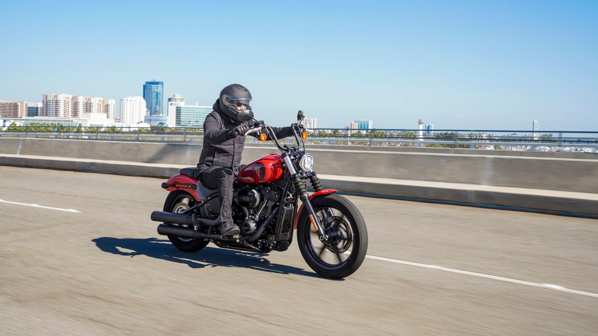 A driving 2022 Harley-Davidson Street Bob