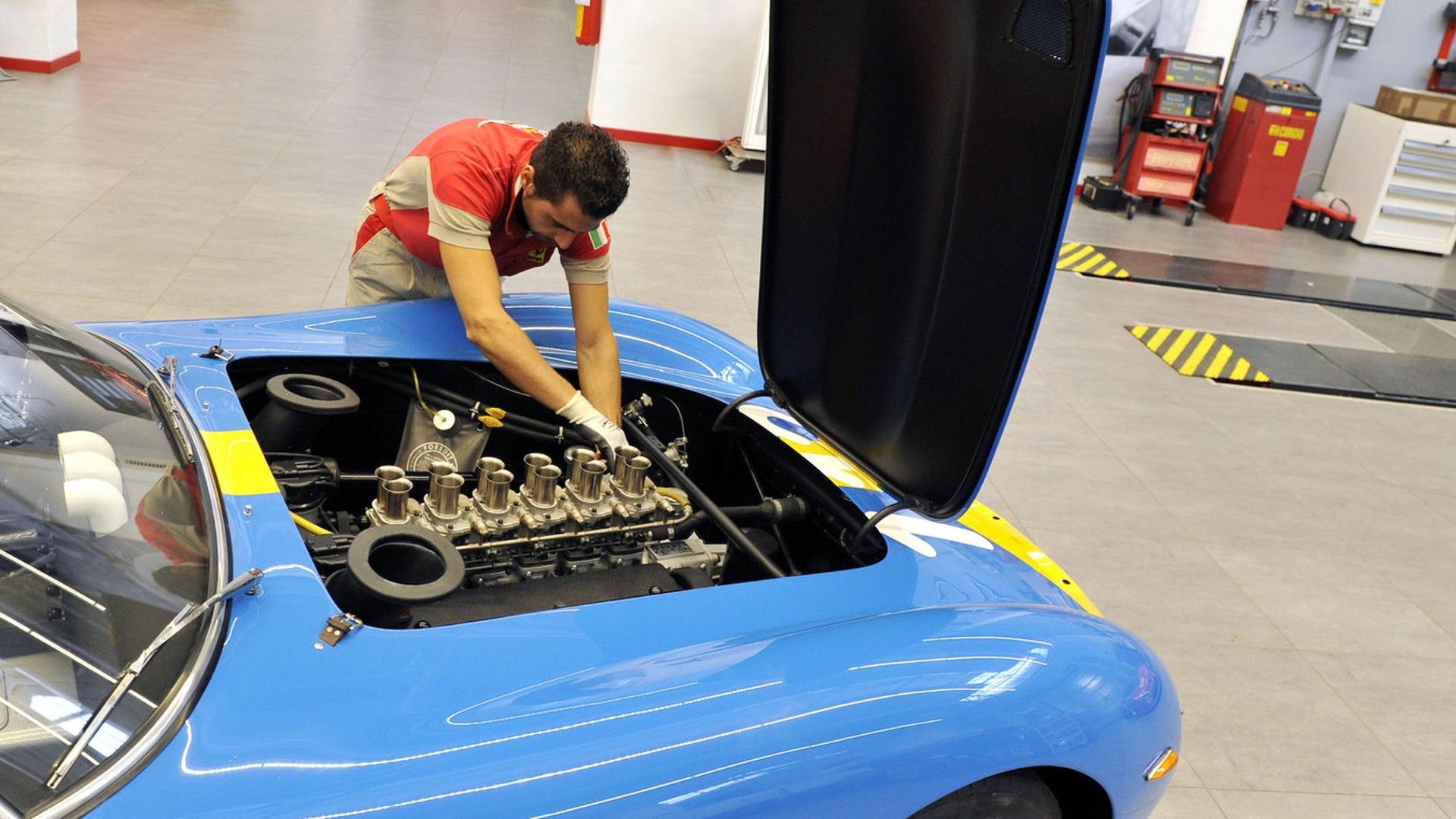 Mechanic working on the Lady in Blue's engine. 