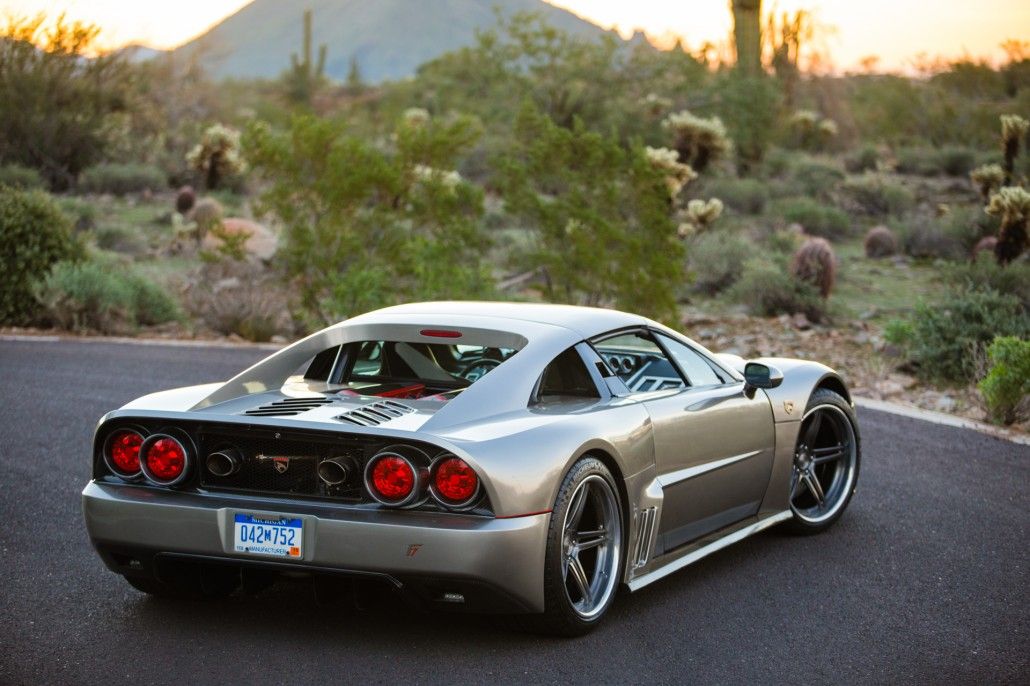 A 3/4 shot from the rear of a grey Falcon F7