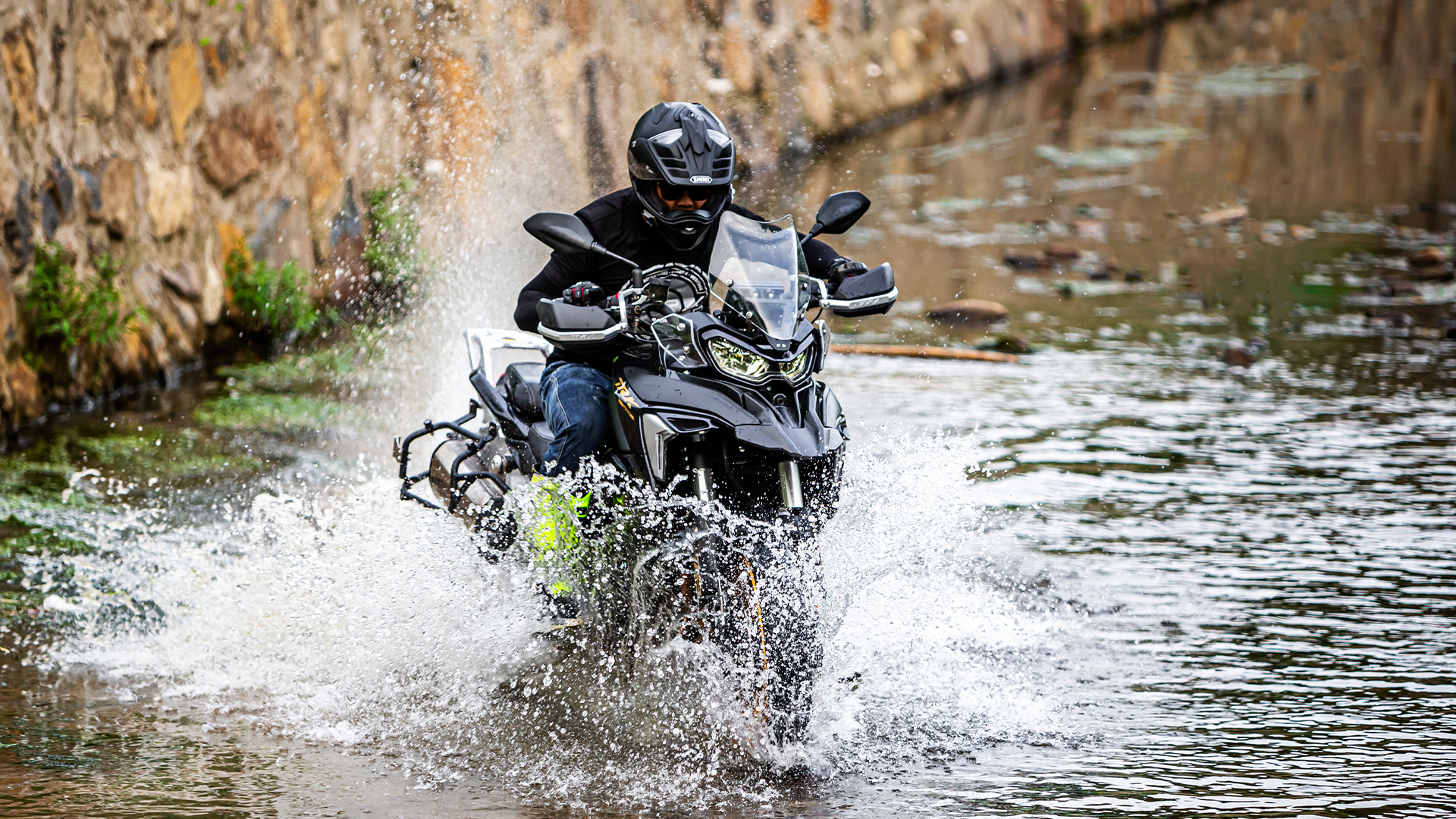 Benelli TRK702 action shot crossing a shallow river