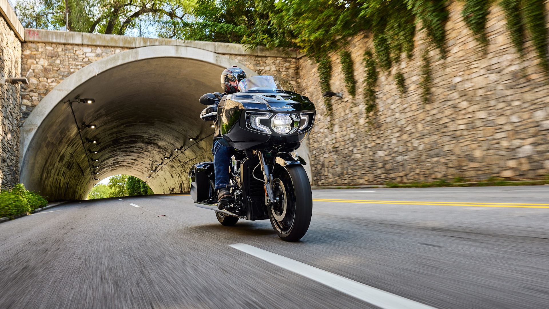 Black 2023 Indian Challenger coming out of a tunnel