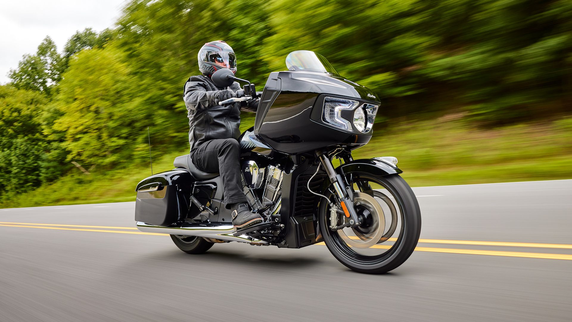 Black 2023 Indian Challenger cruising on the highway