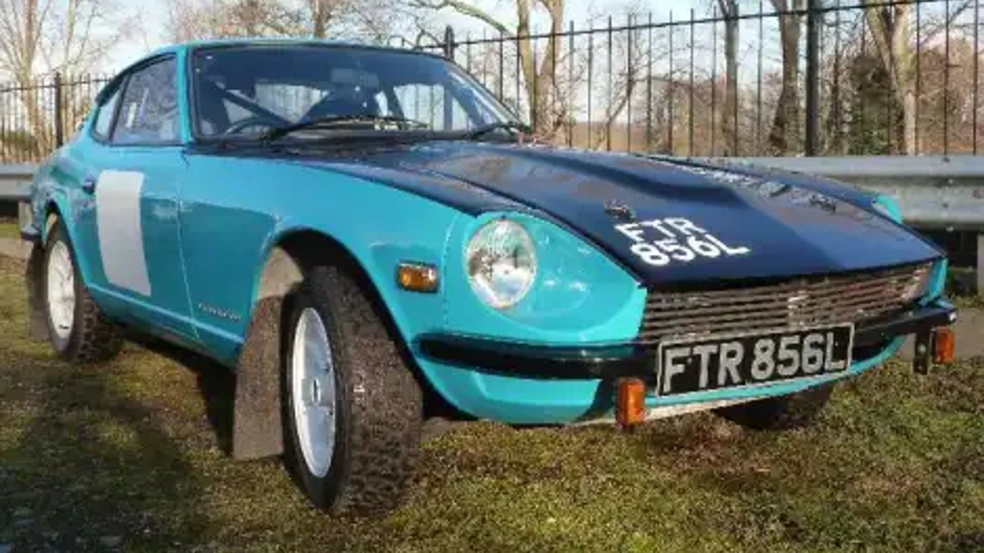 Shot of the front of a blue Datsun 240Z.