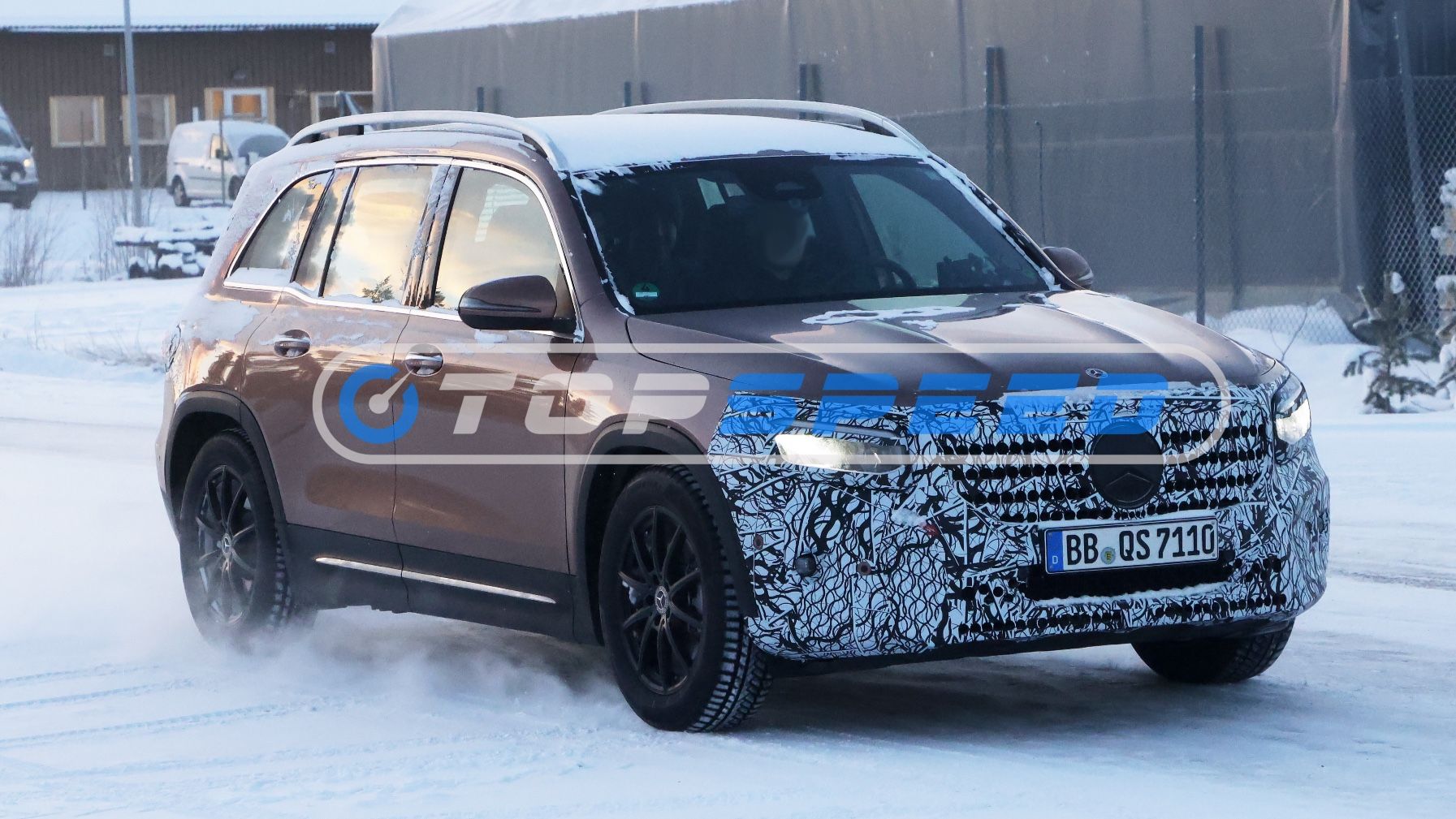 A Mercedes GLB test vehicle driving in snow.
