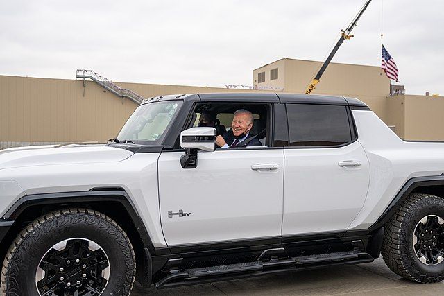 President Biden test drives a white Hummer EV.