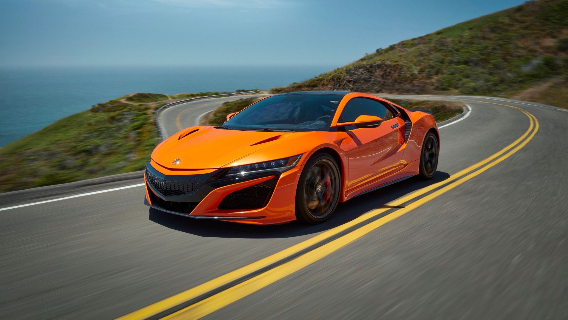 Front 3/4 shot of a 2019 Acura NSX cruising