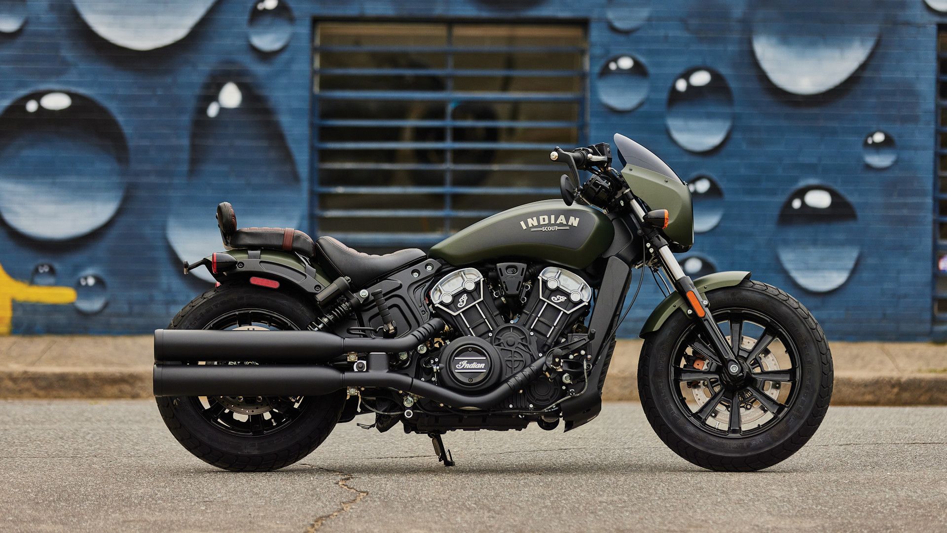 Accessorized green 2023 Indian Scout Bobber on the kickstand