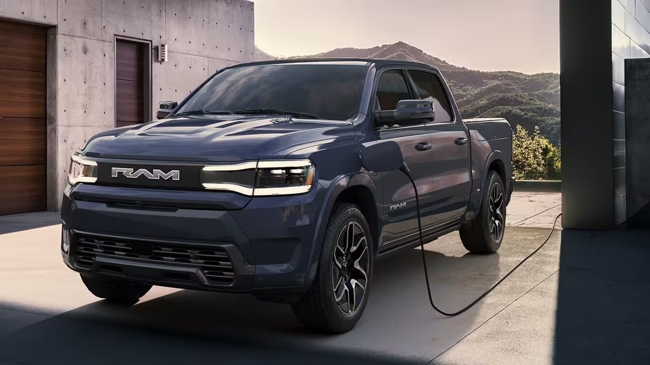 A 2023 Ram 1500 REV on a charging station
