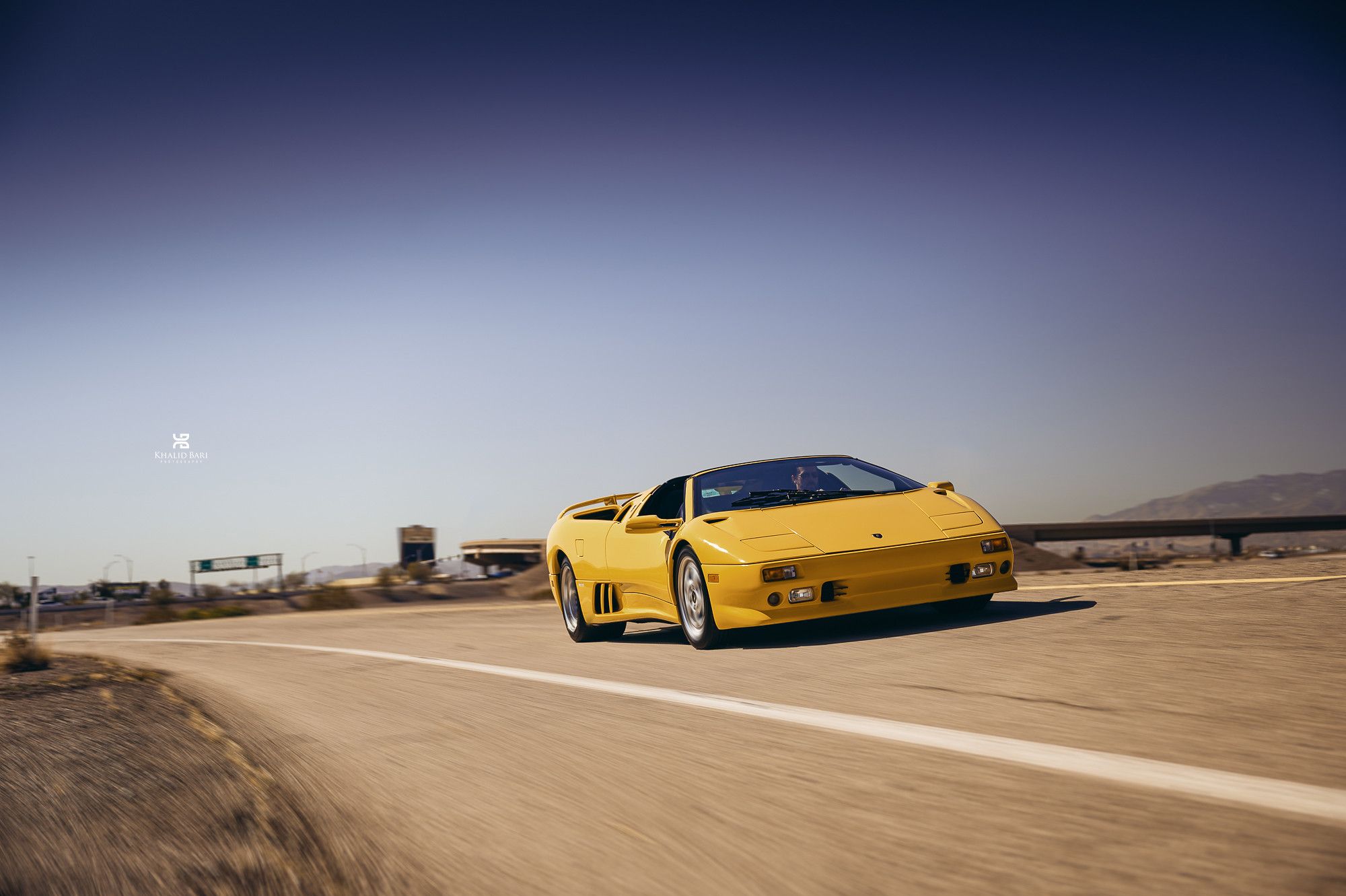 Yellow Lamborghini Diablo speeding down the highway