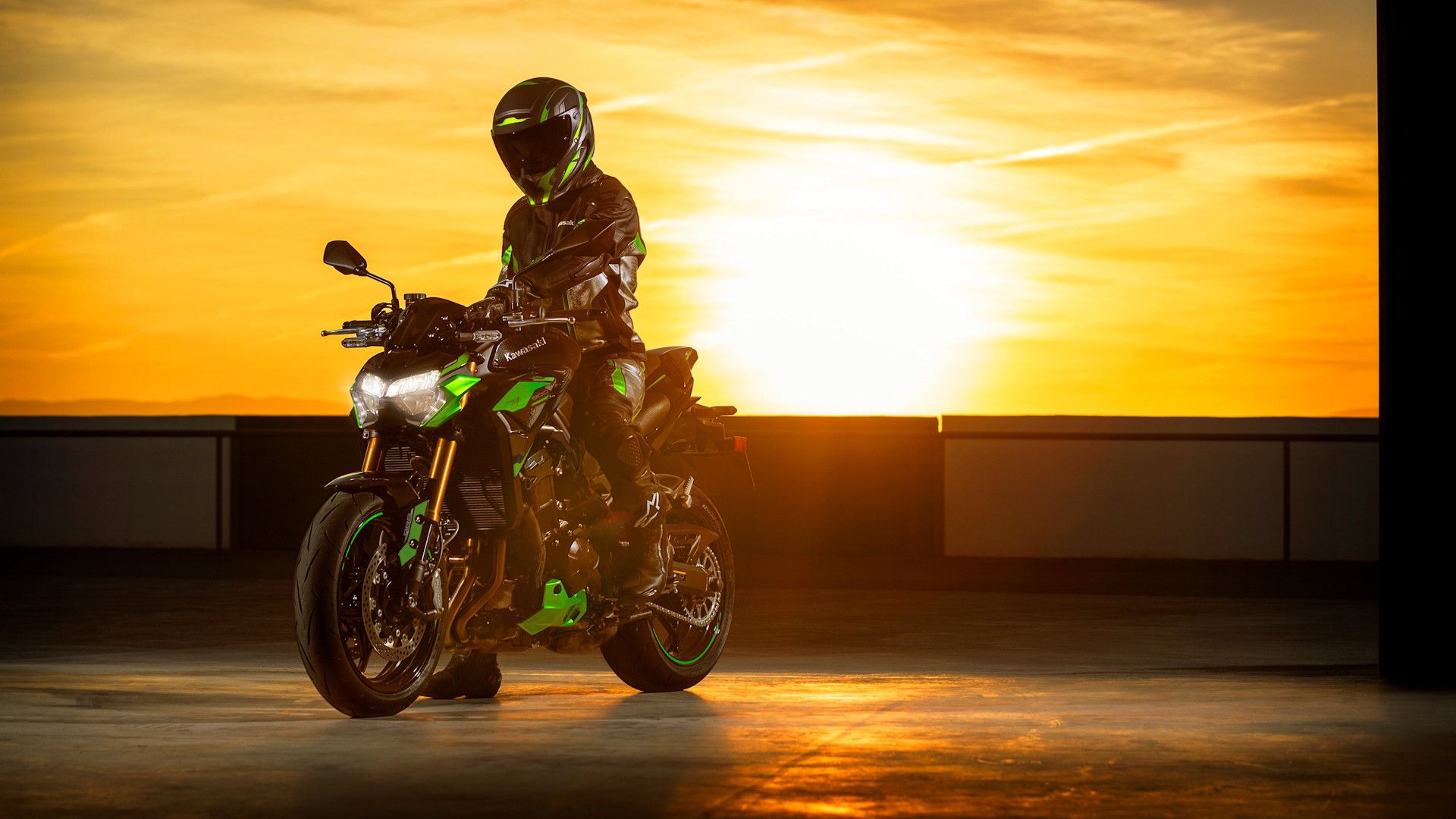 Green 2024 Kawasaki Z900 SE in front of a sunburst