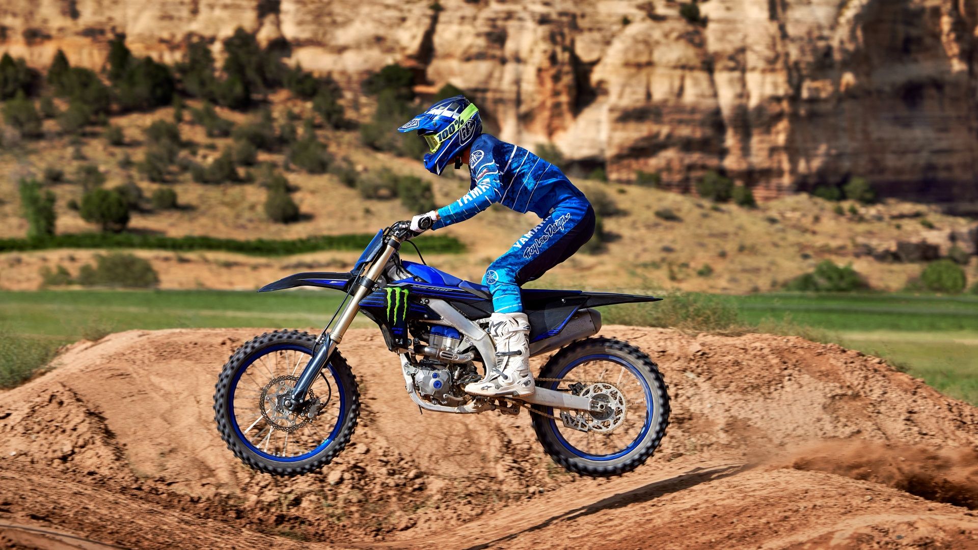 An action shot of a 2023 YAMAHA YZ450F on the dirt track