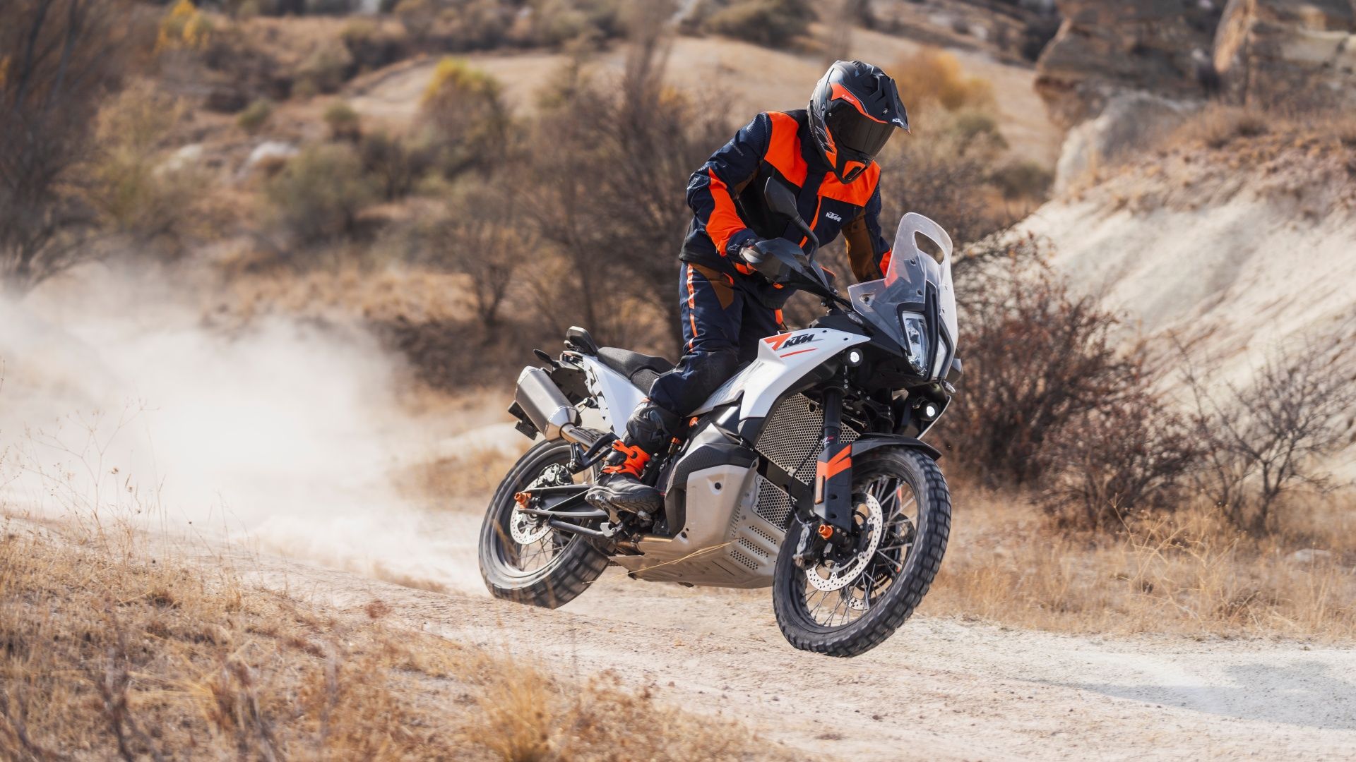 An action shot of the 2023 KTM 790 ADVENTURE riding on the dirt