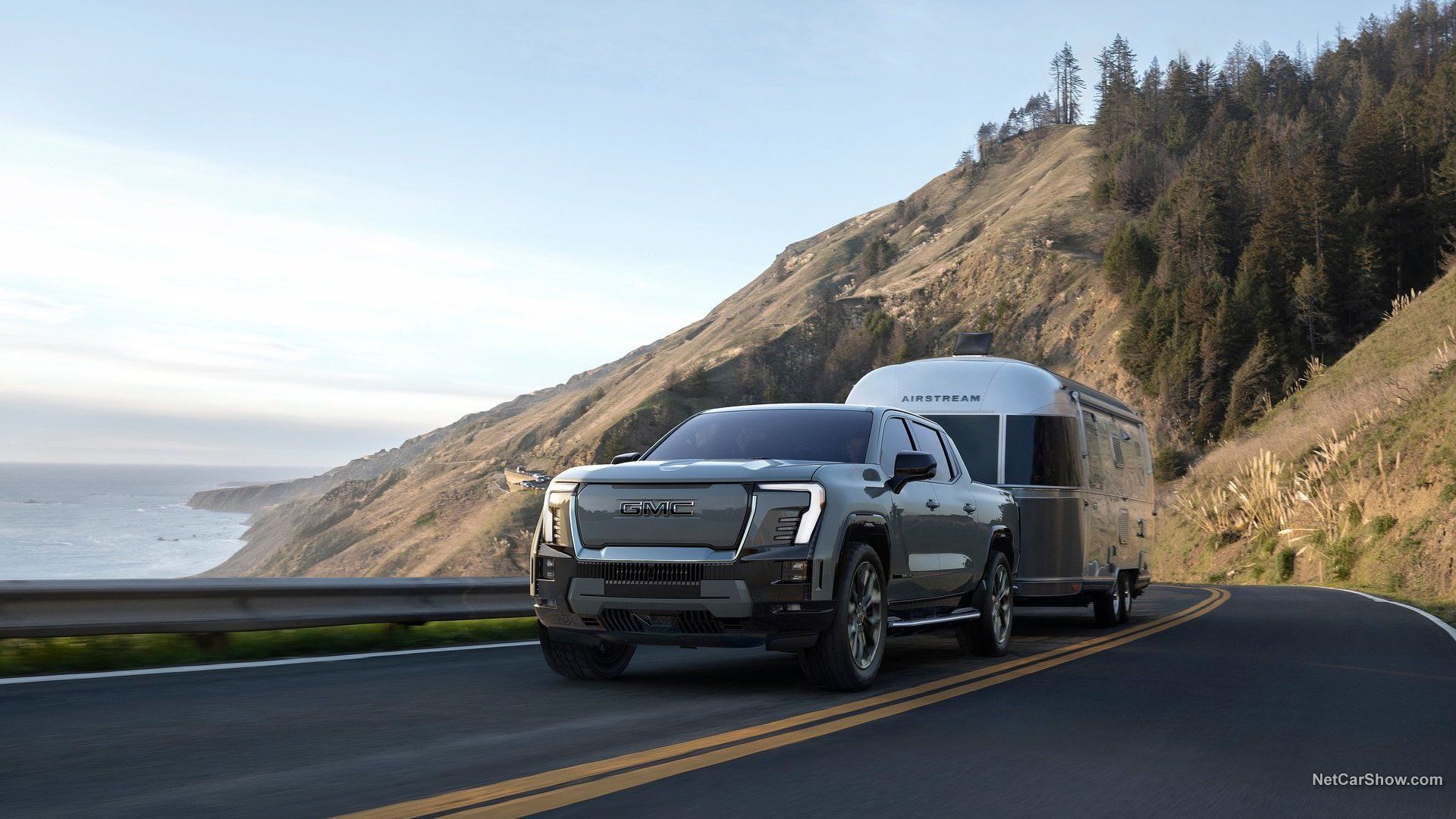 2024 GMC Sierra EV Denali Edition 1 towing a travel trailer