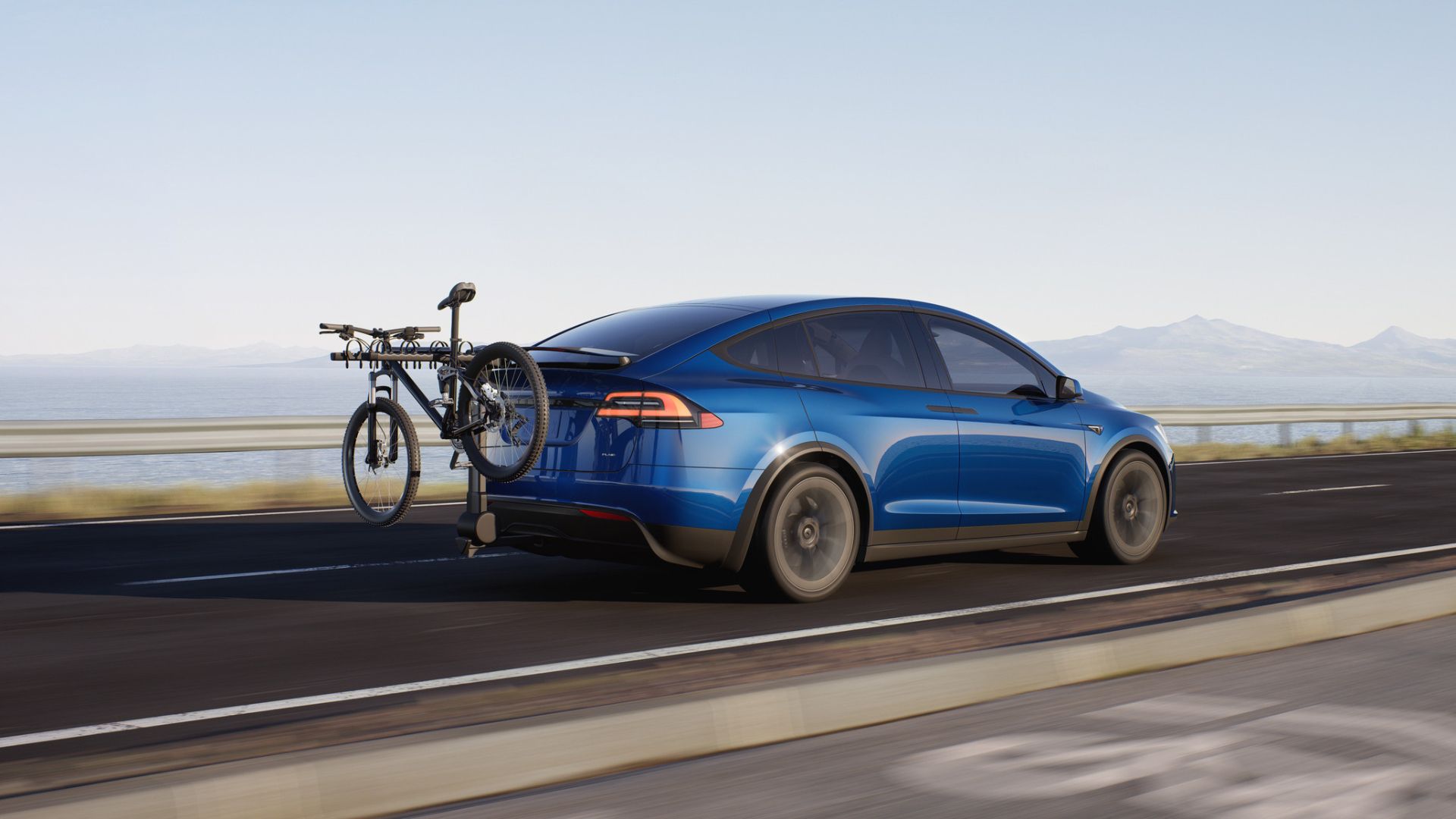 Foto sudut belakang Tesla Model X warna biru