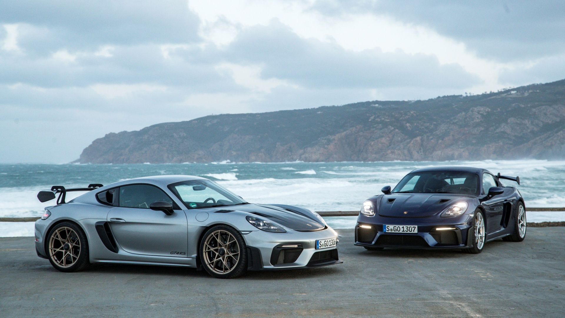 two Porsche 718 Cayman GT4 RS parked