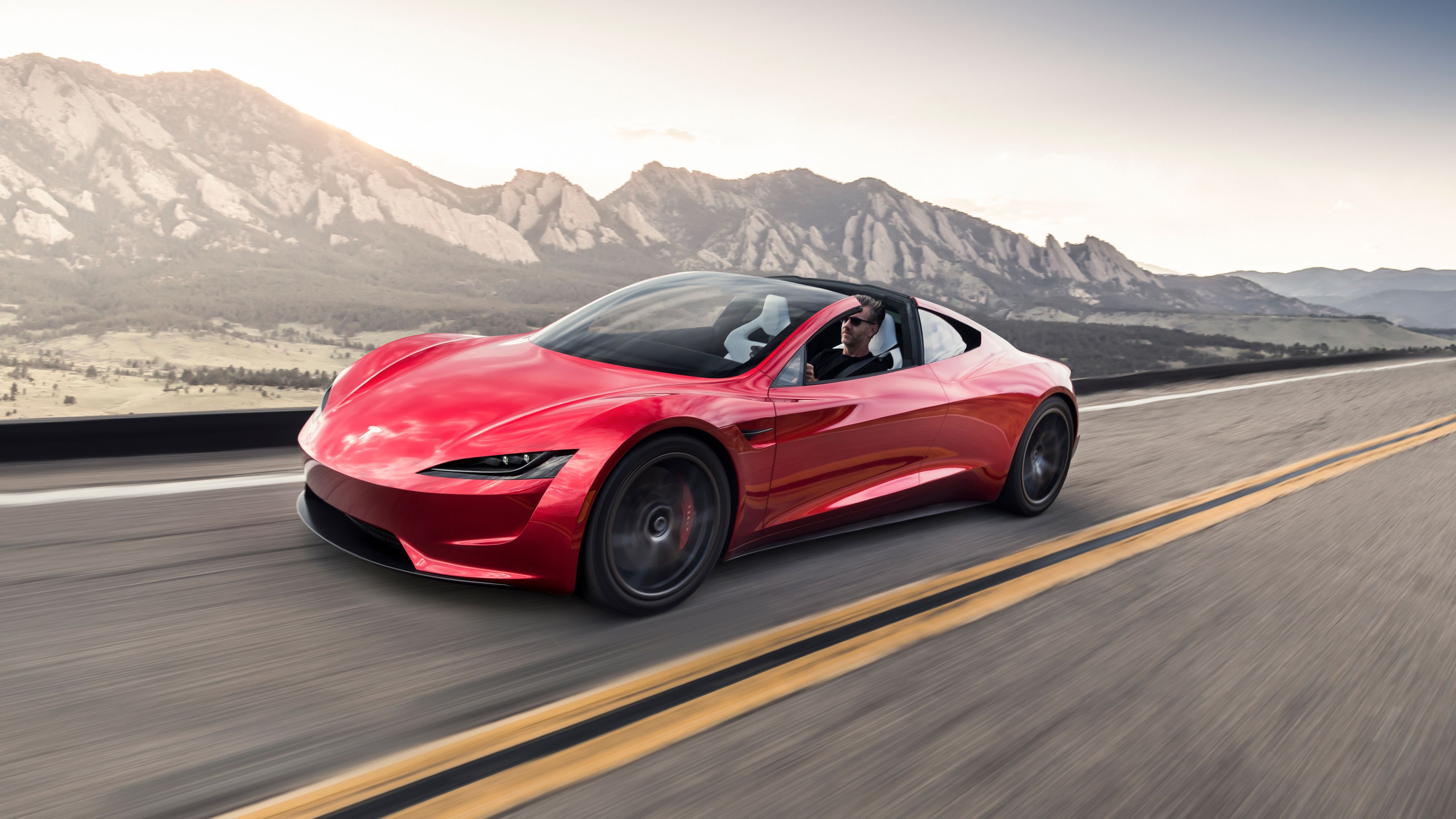 Mobil Tesla Roadster 2023 berwarna merah.