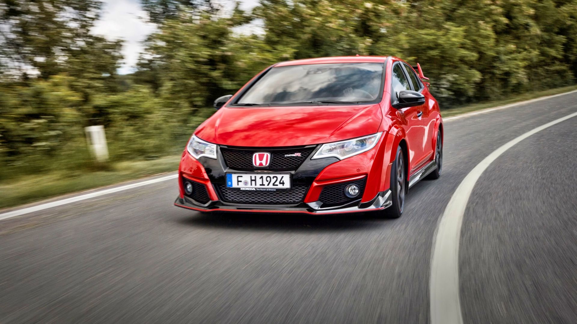 Front shot of a 2015 Honda Civic Type R taking a corner