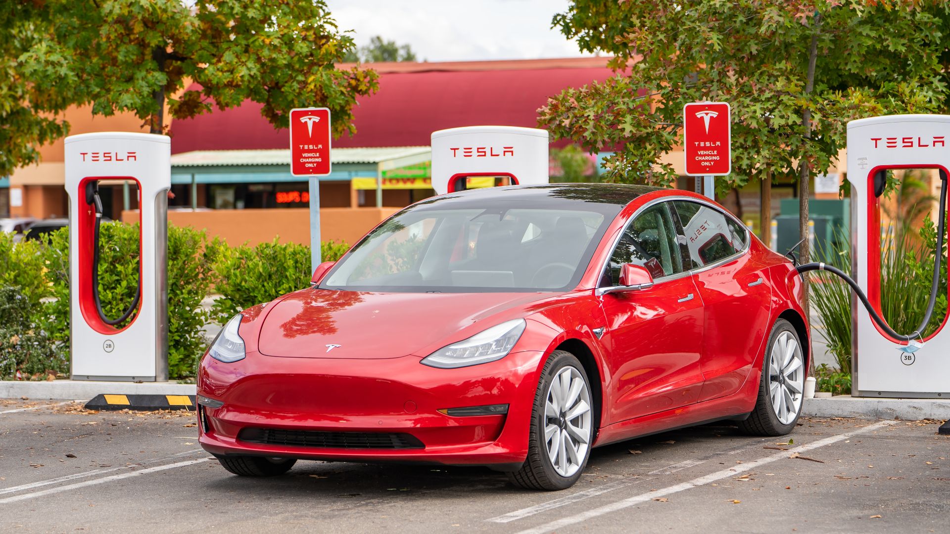 Tesla at a Supercharger Station