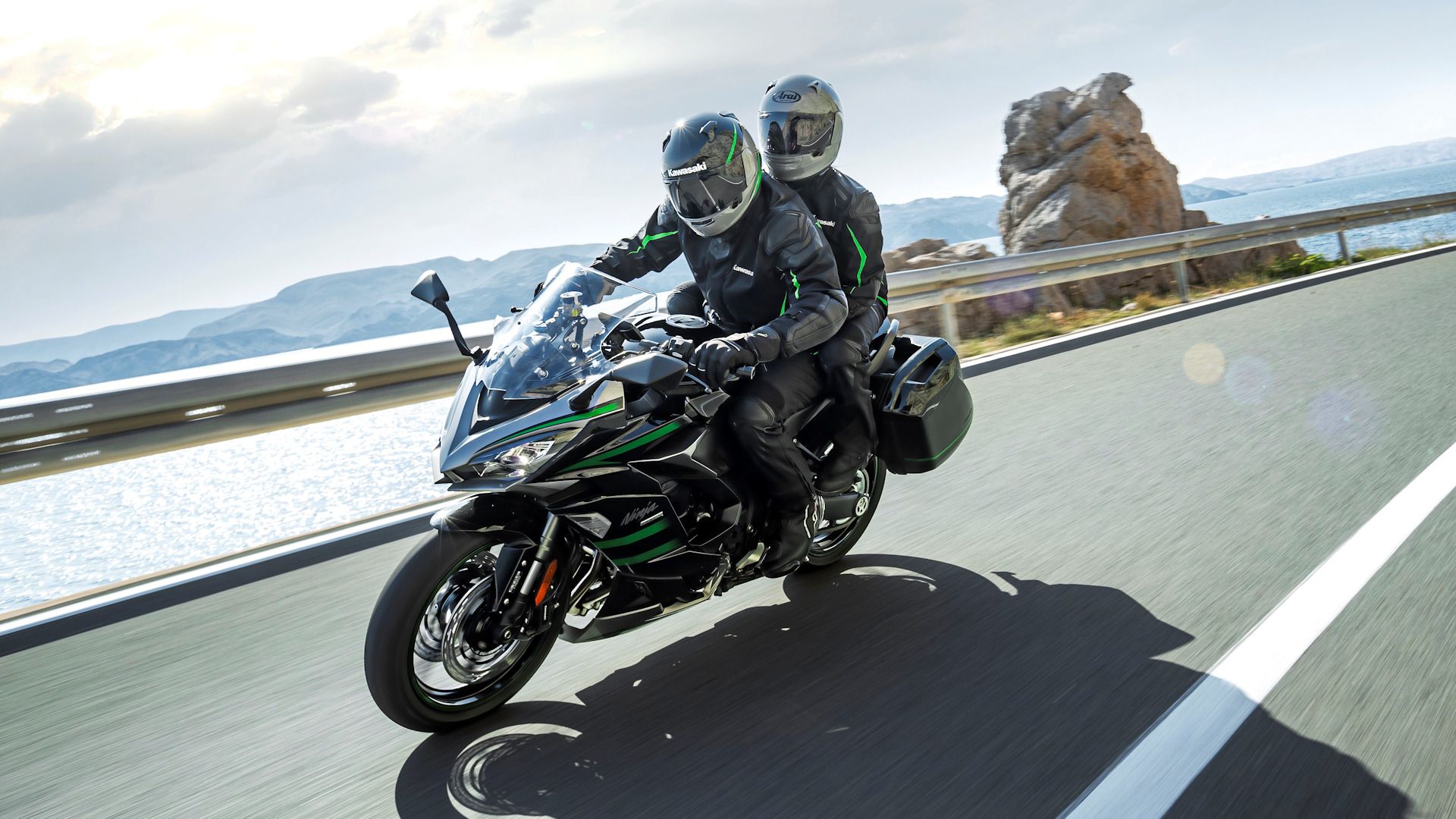 Two-up riding on a gray 2020 Kawasaki Ninja 1000SX shown with accessory Touring package
