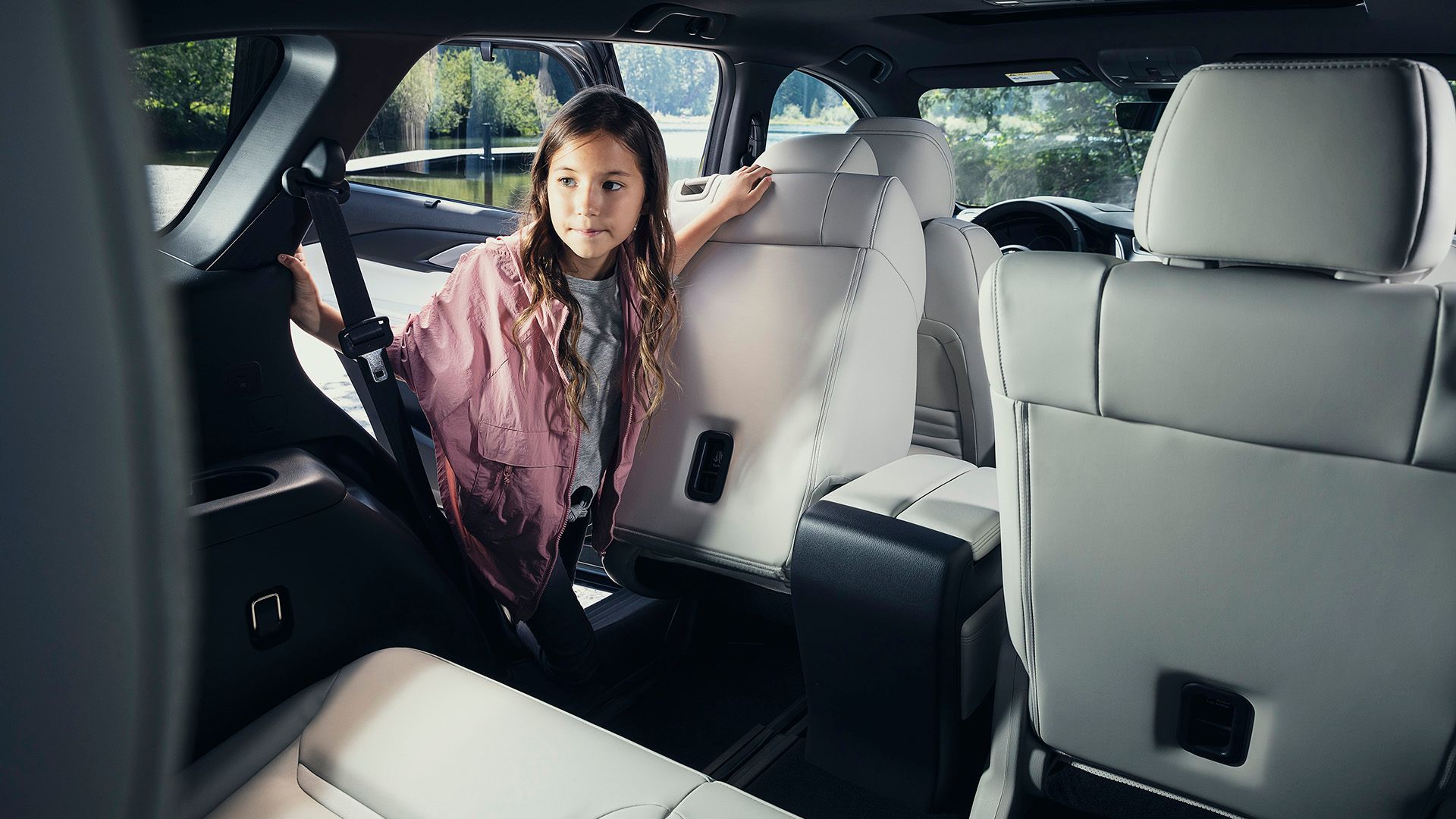 A child gets into the third row of the 2023 Mazda CX-9 Signature