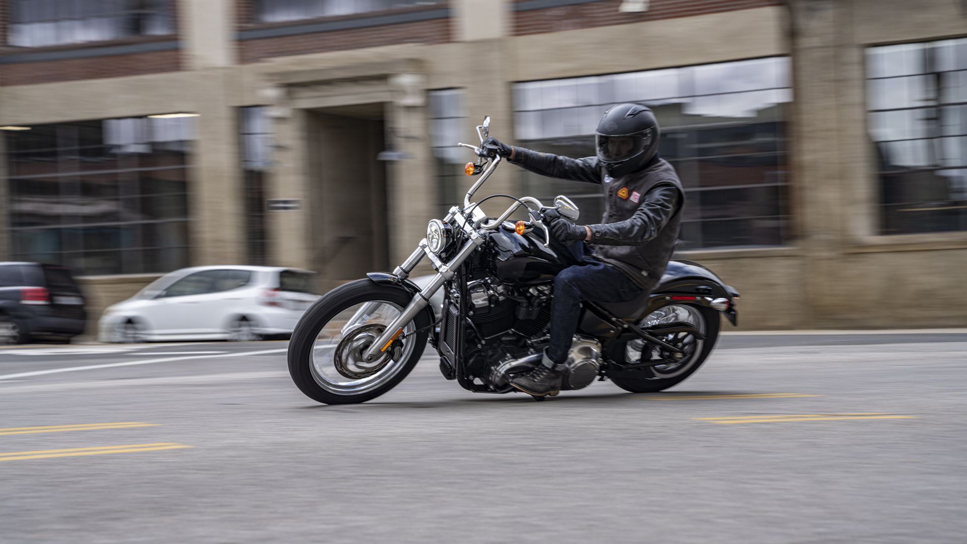 Black 2021 Harley-Davidson Softail Standard leaning into a turn