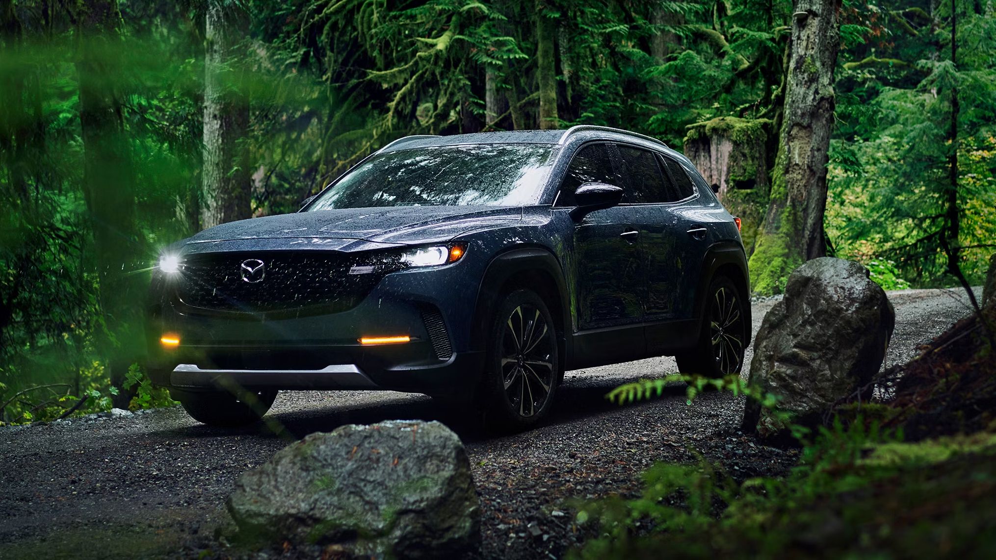 2023 Mazda CX-50 on an off-road trail in the forest