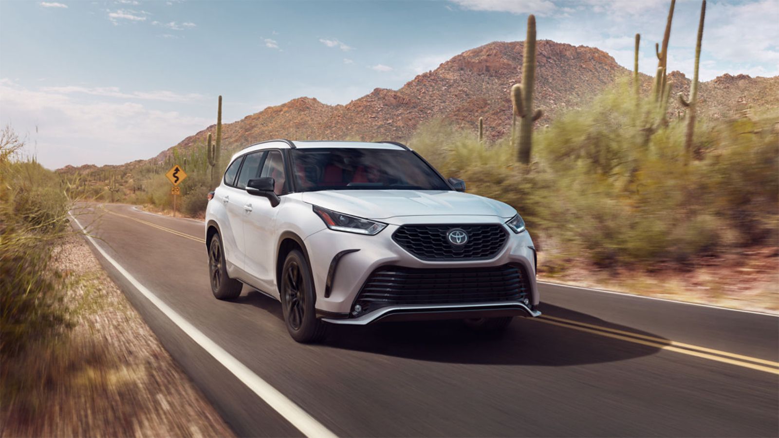 Toyota Highlander midsize SUV profile representing a comfortable, reliable used option under $30,000