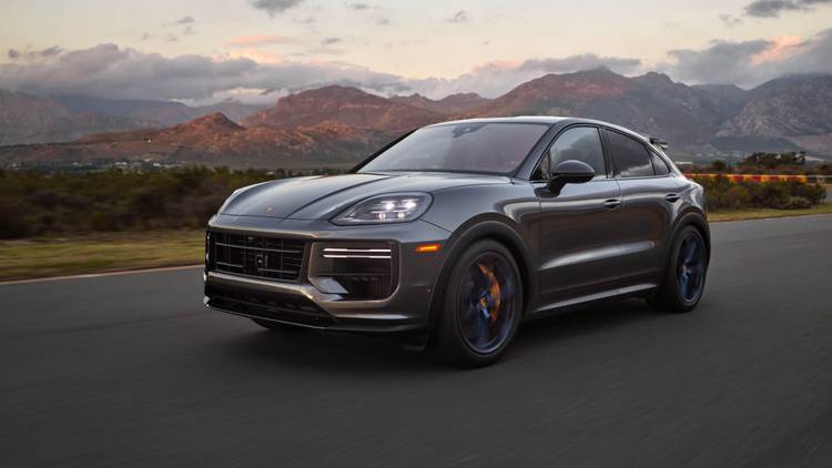 A 2024 Porsche Cayenne Turbo GT driving on track