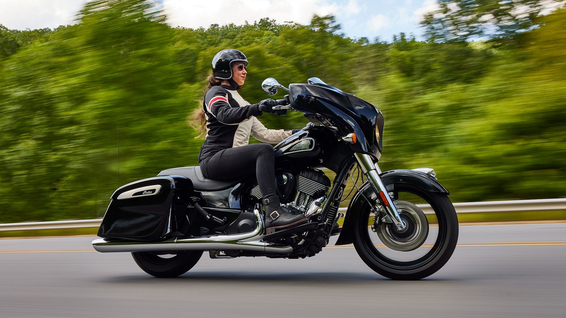 Black 2023 Indian Chieftain cruising up the road