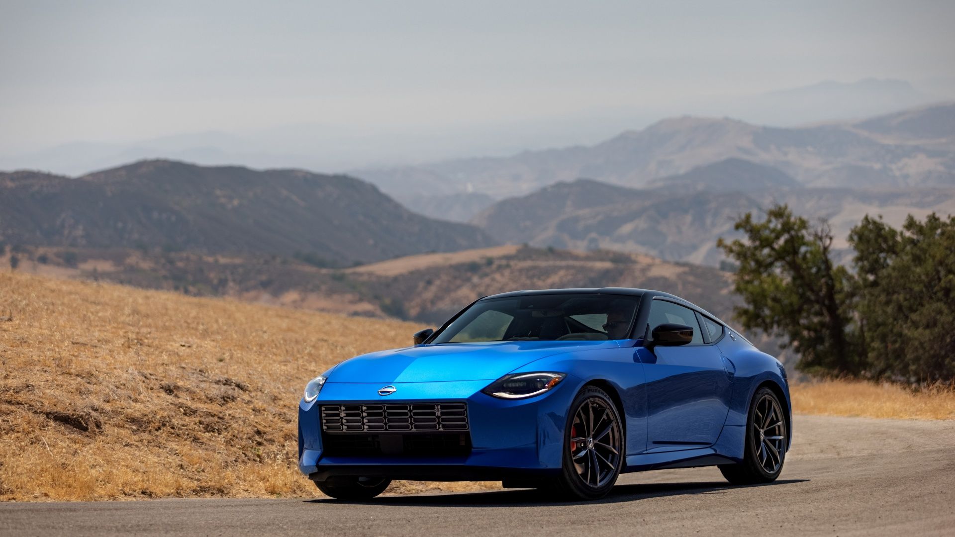 A front 3/4 shot of a blue 2023 Nissan Z on the road